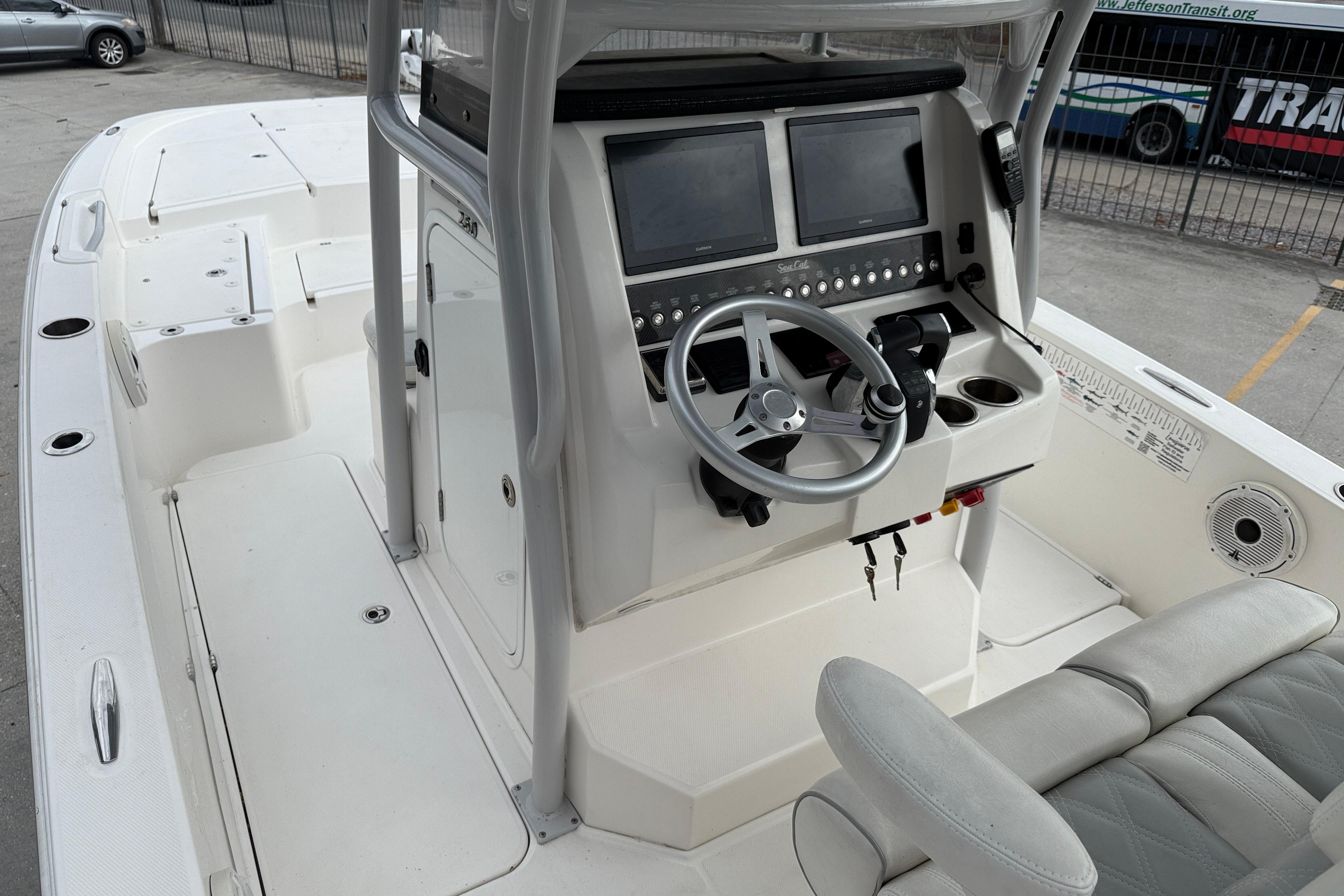 2021 Sea Cat 260 boat interior with dual screens and steering wheel.