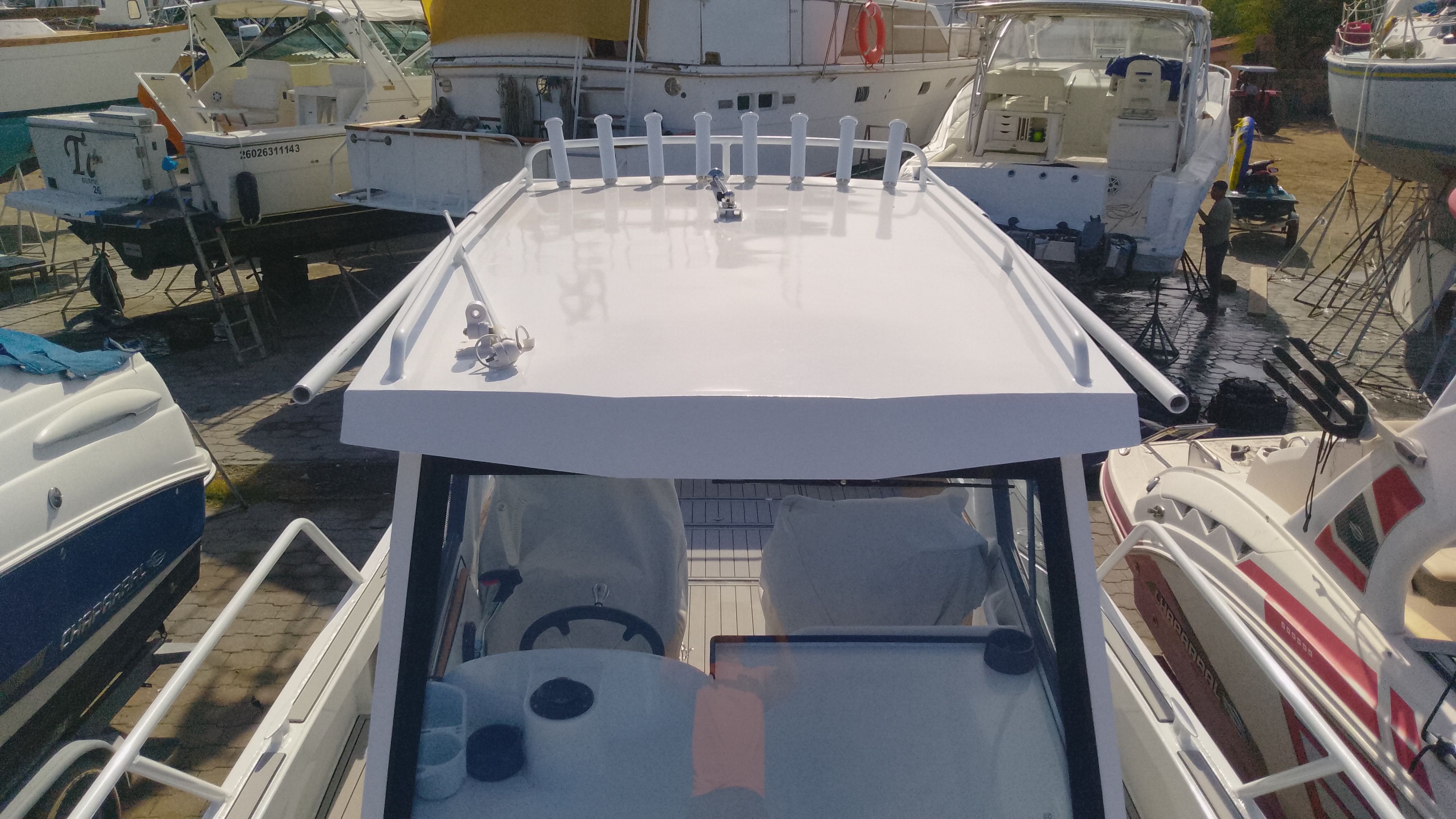 Gospel Boat 7.5M 2024 in harbor, surrounded by other boats.