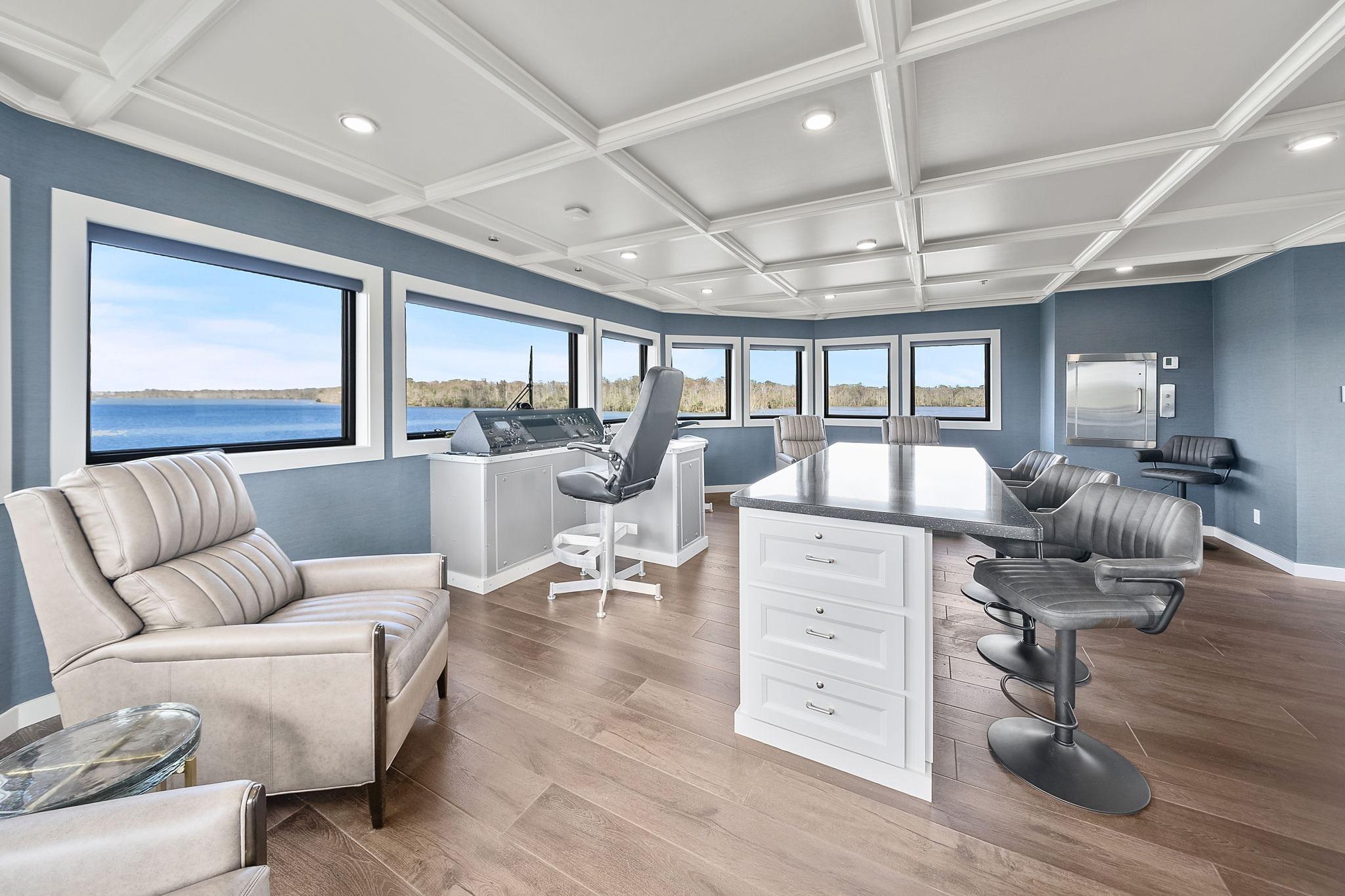 Luxurious interior of 2025 Breaux Brothers 120 GLV yacht with panoramic windows and modern furnishings.