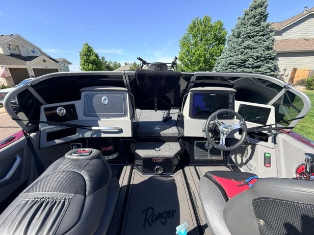 The cockpit of a 2024 Ranger 621FS Pro with modern instruments and comfortable seating.