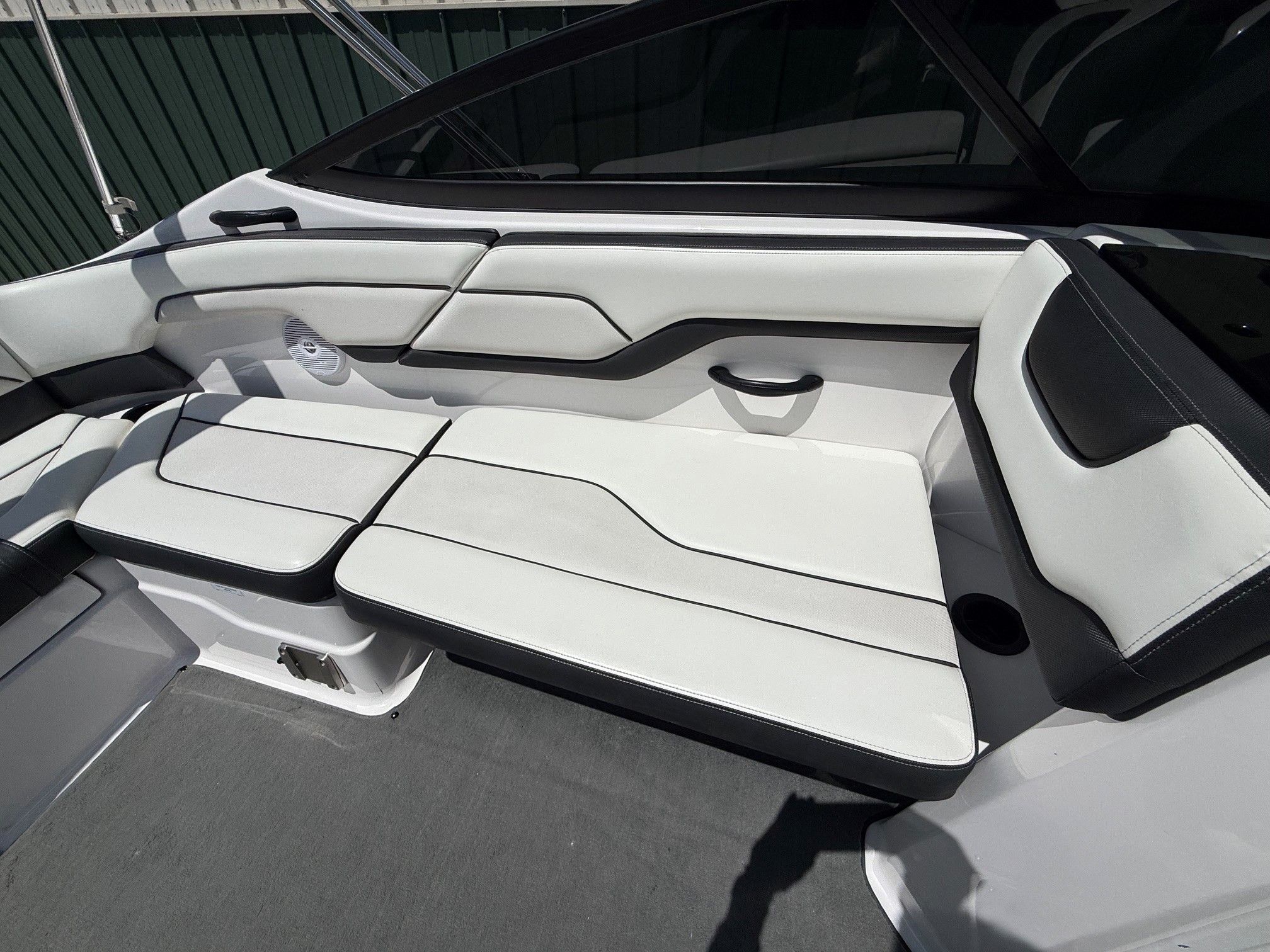 Interior view of a Yamaha SX210 boat with white and black seating.