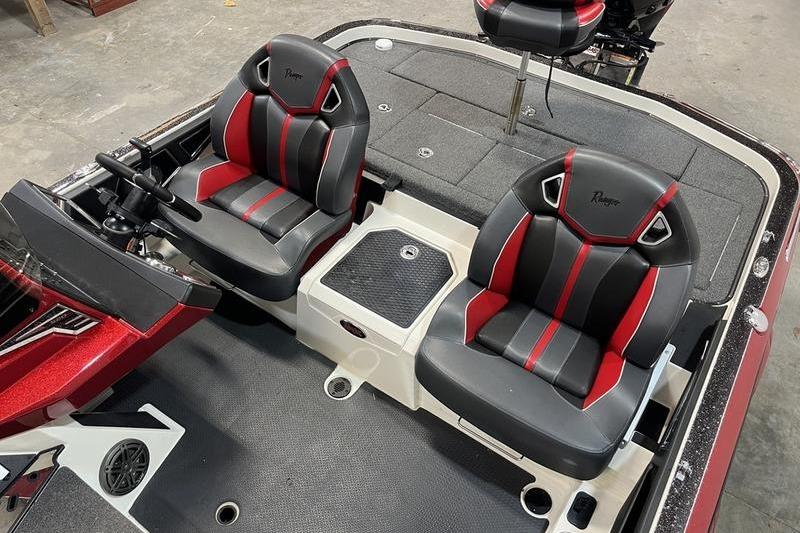 2022 Ranger Z520R boat interior with black and red seats, steering console, and storage compartments.