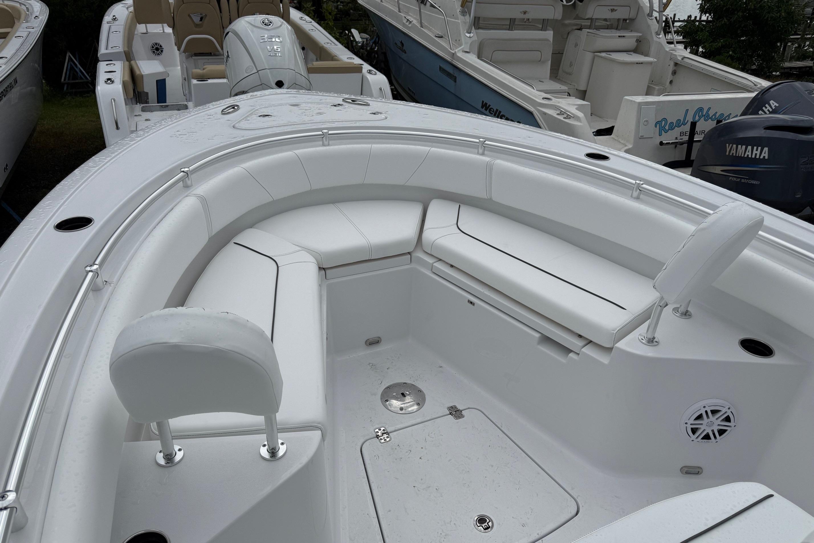 2026 Sportsman Heritage 231 Center Console boat with white seating and spacious deck.
