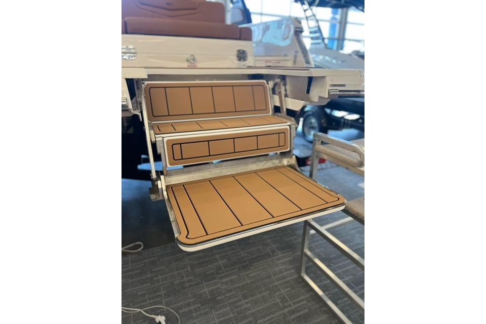 2025 Chaparral 247 SSX boat swim platform with teak-style decking.