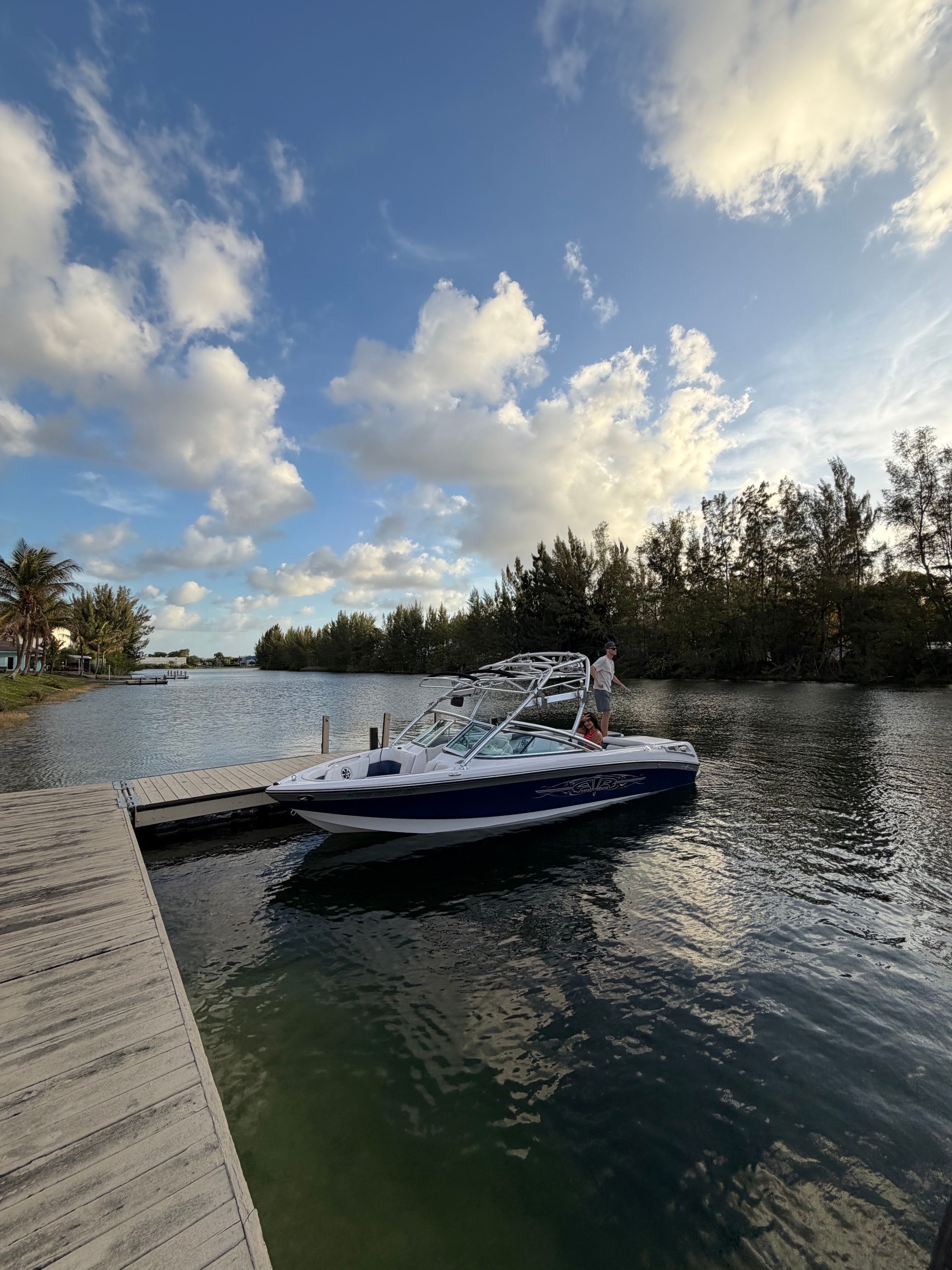 2008 Nautique 236 Team Edition boat docked at sunset.