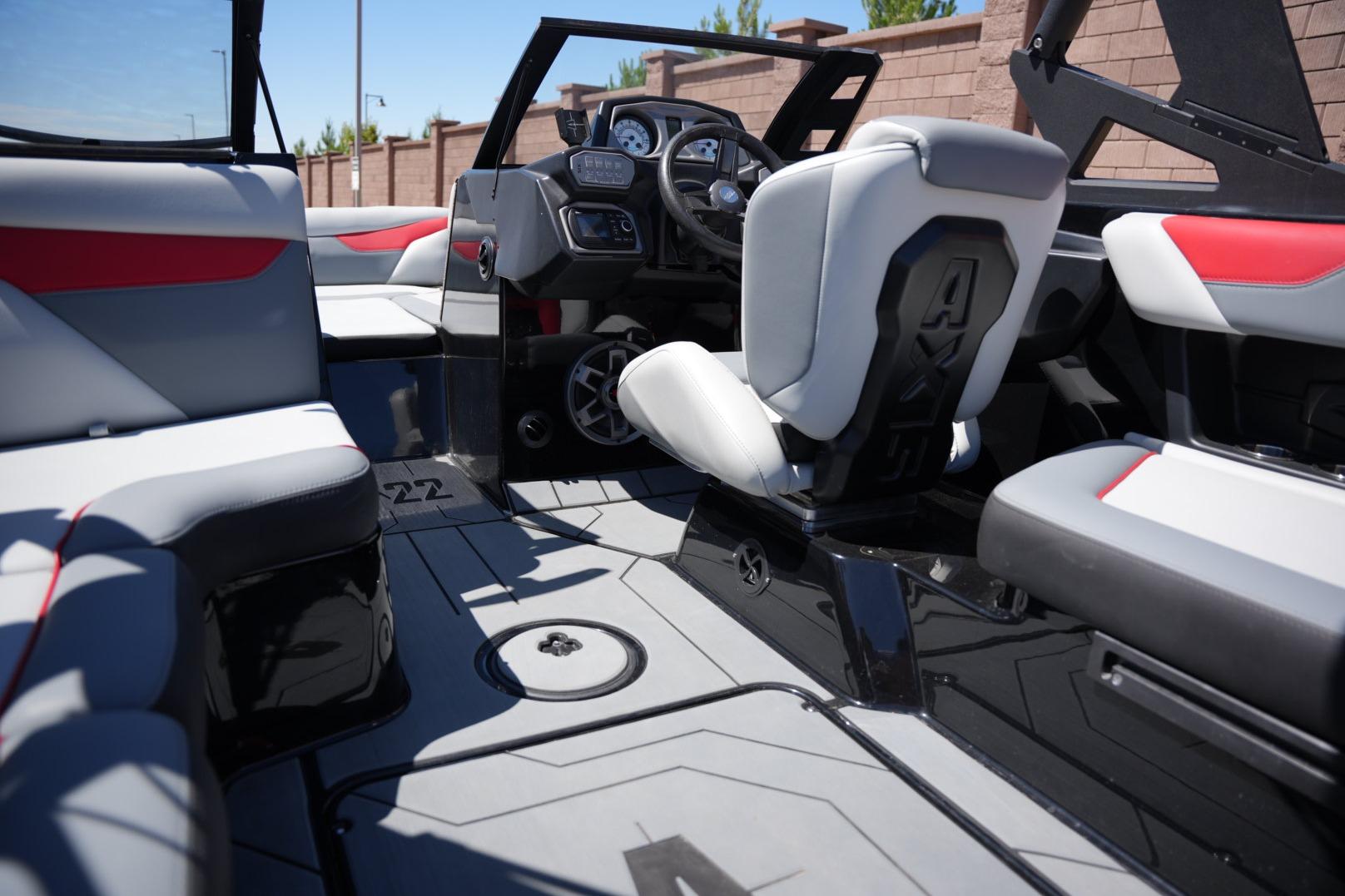 Interior of a 2019 Axis A22 boat with modern seating and dashboard.