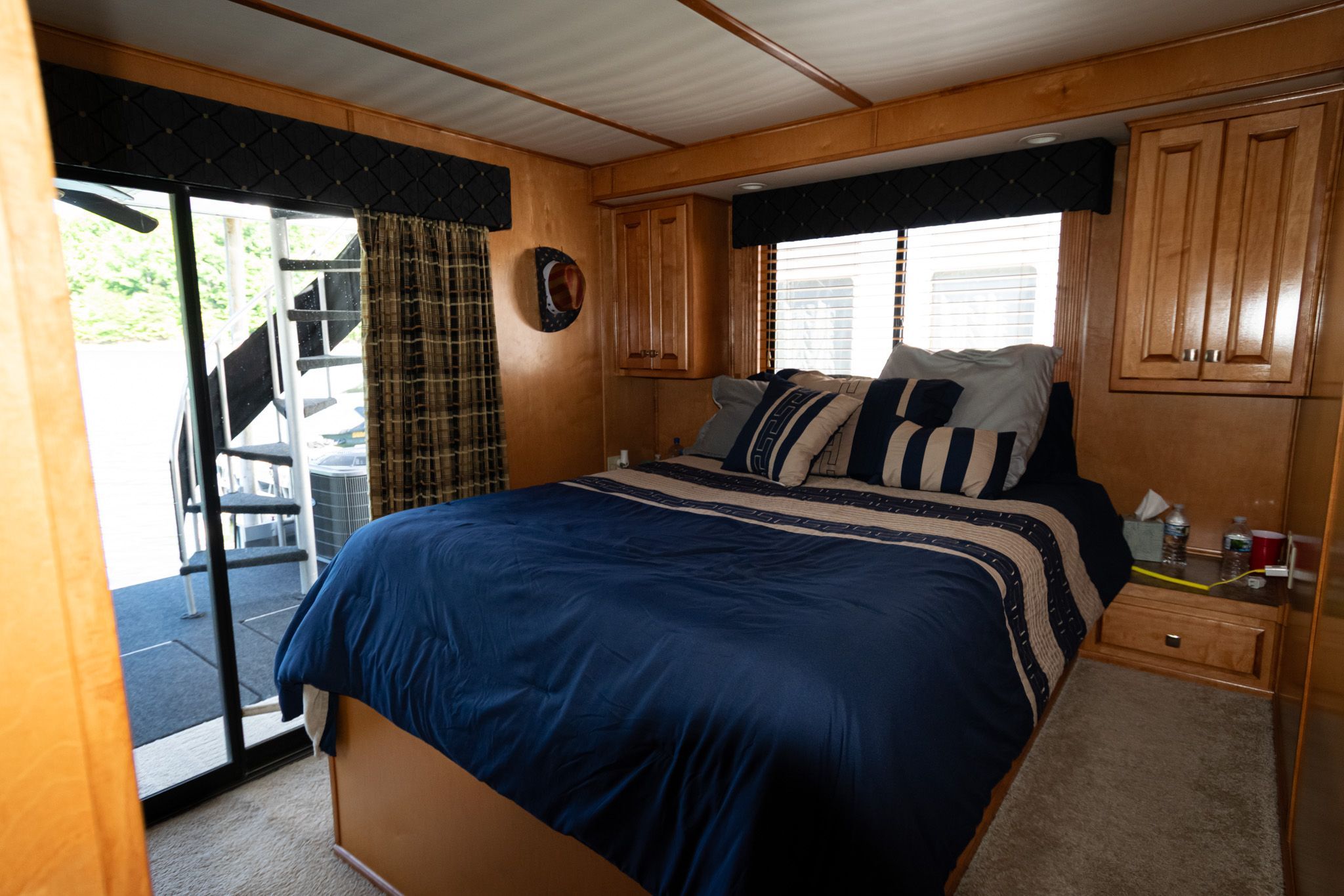 Bedroom in a 2003 Lakeview 16x70 houseboat.