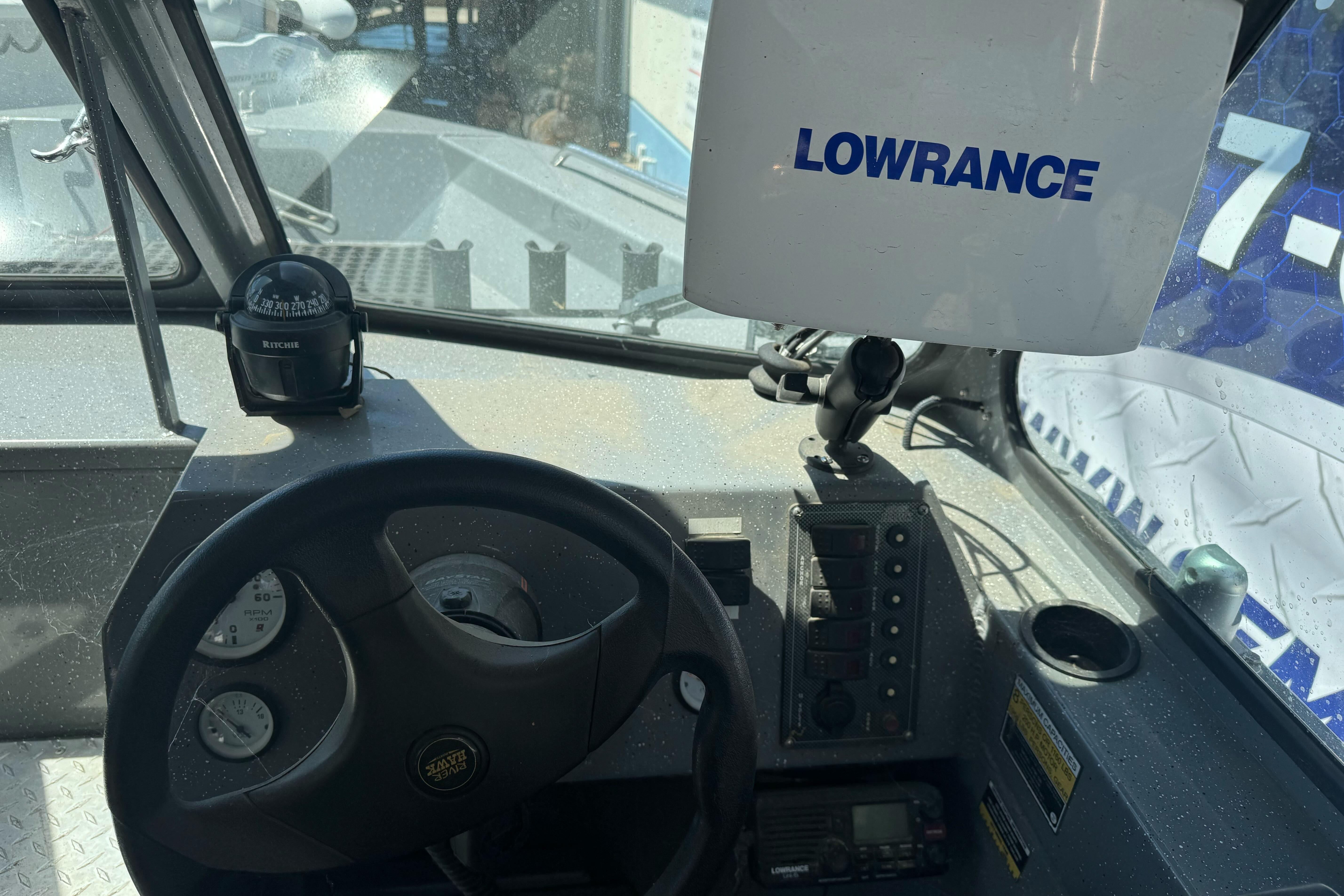 Interior of a 2014 River Hawk 19 GB boat with Lowrance navigation system.
