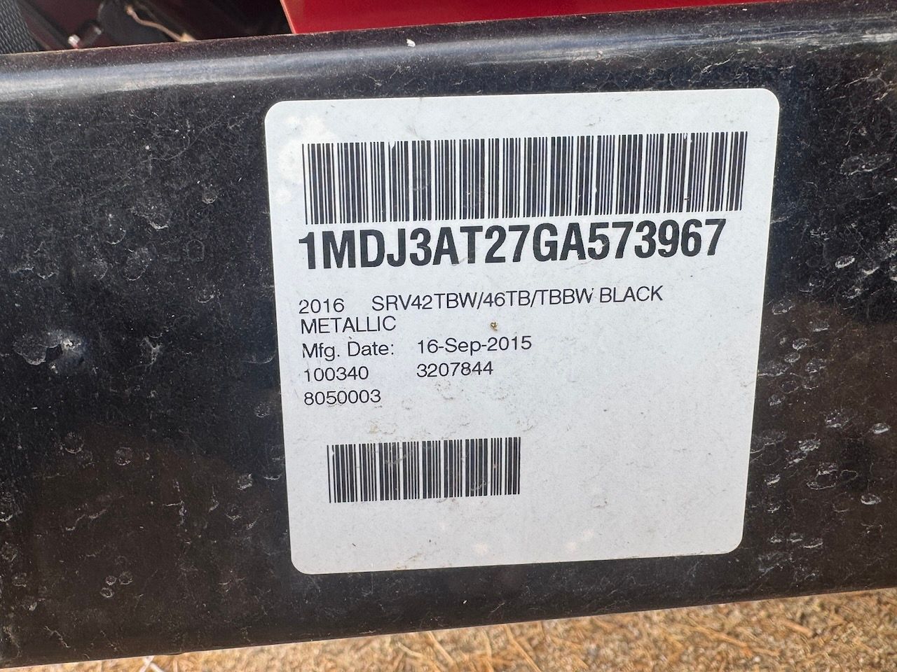 A label on a boat showing serial number and manufacturing date.