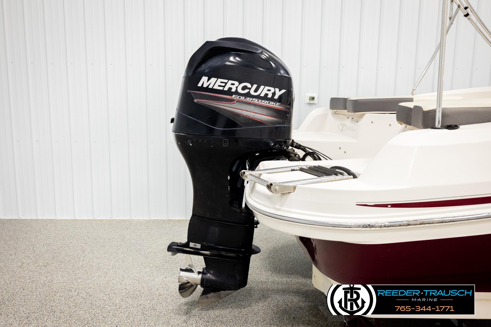 2016 Tahoe 450 TS boat with Mercury FourStroke outboard motor in showroom.