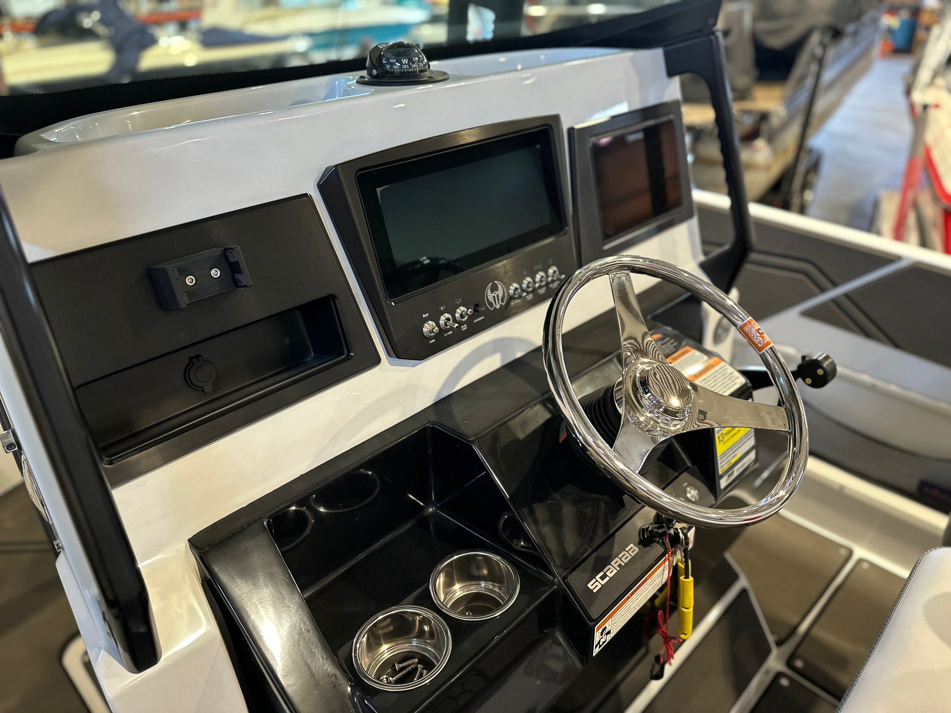 The image shows the helm of a 2021 Scarab 255 Open ID boat.