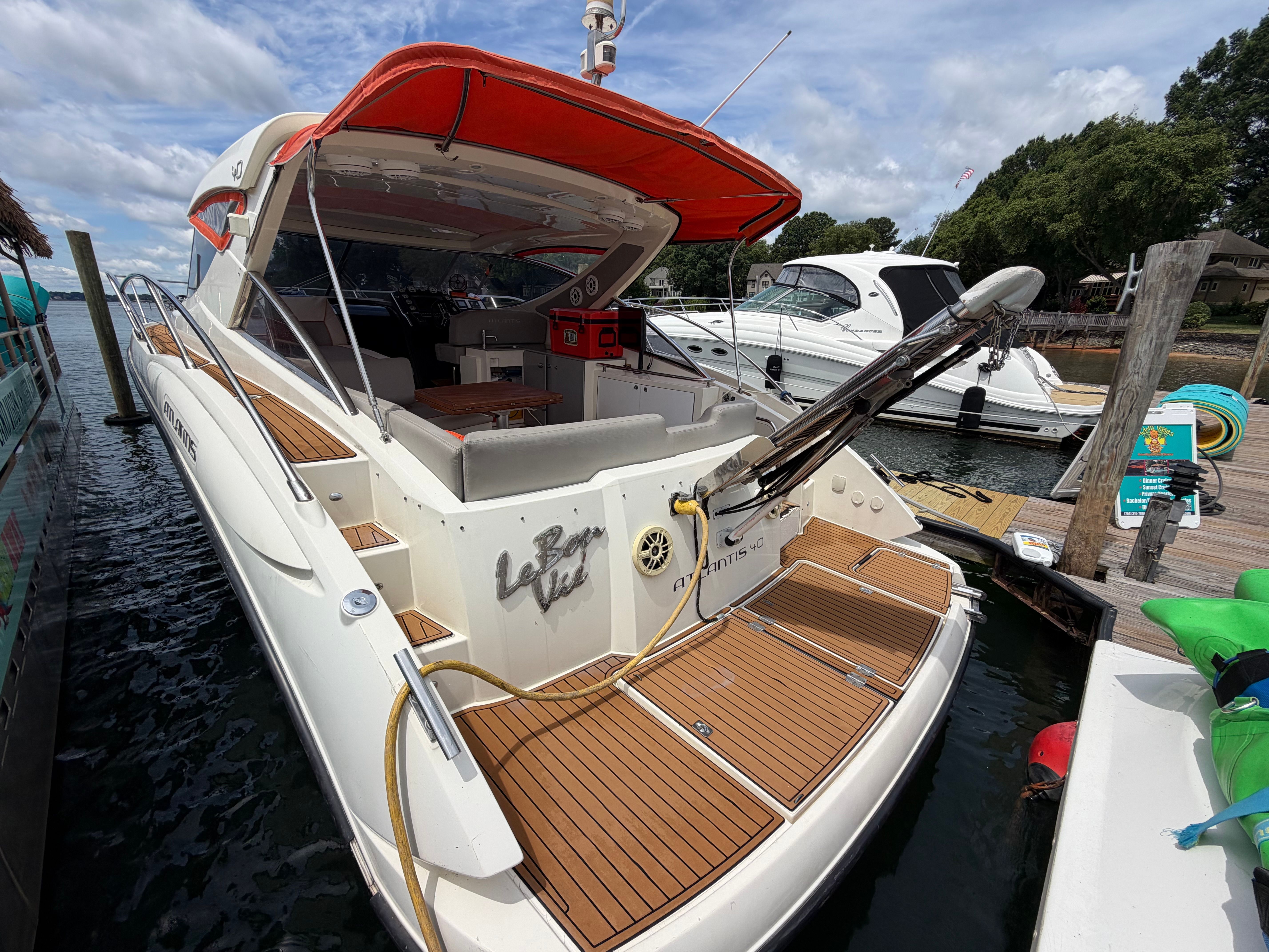 2011 Azimut Atlantis 40 at dock with open cockpit and teak decking.