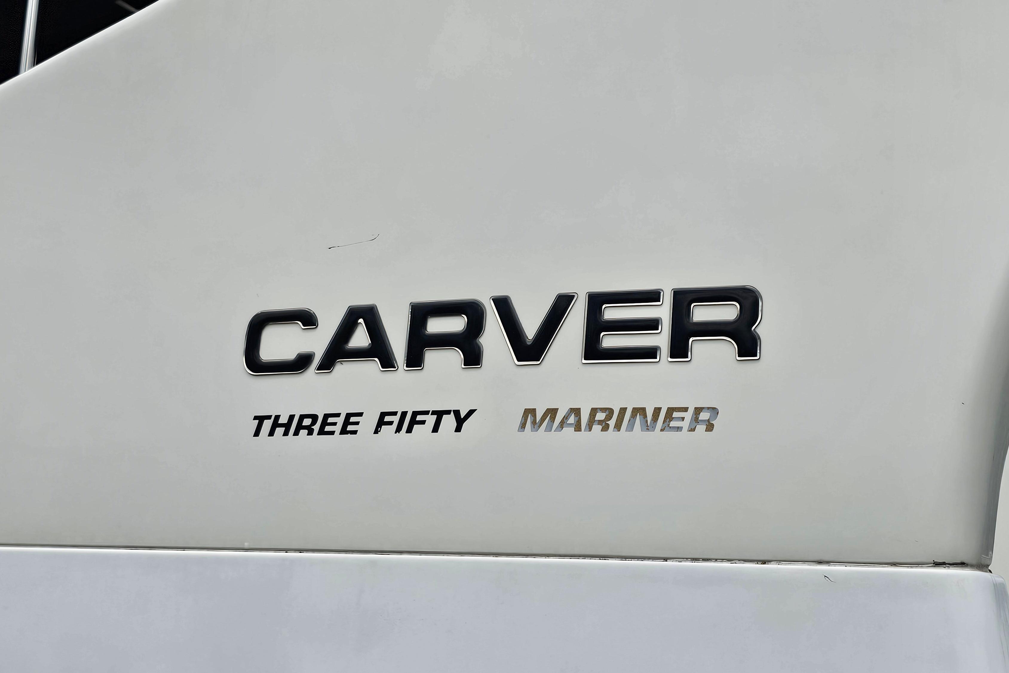 1999 Carver 350 Mariner logo on white surface, showcasing model name.