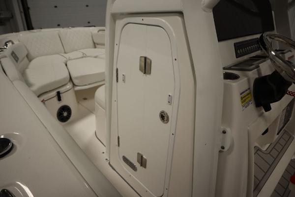 2025 Sea Fox 228 Commander boat interior with seating and control panel.