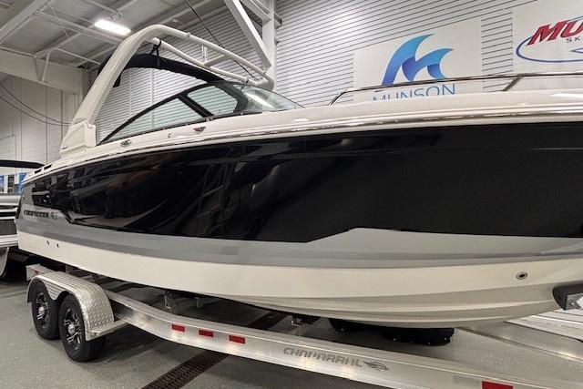 2026 Chaparral SSX 8 boat on trailer in showroom setting.