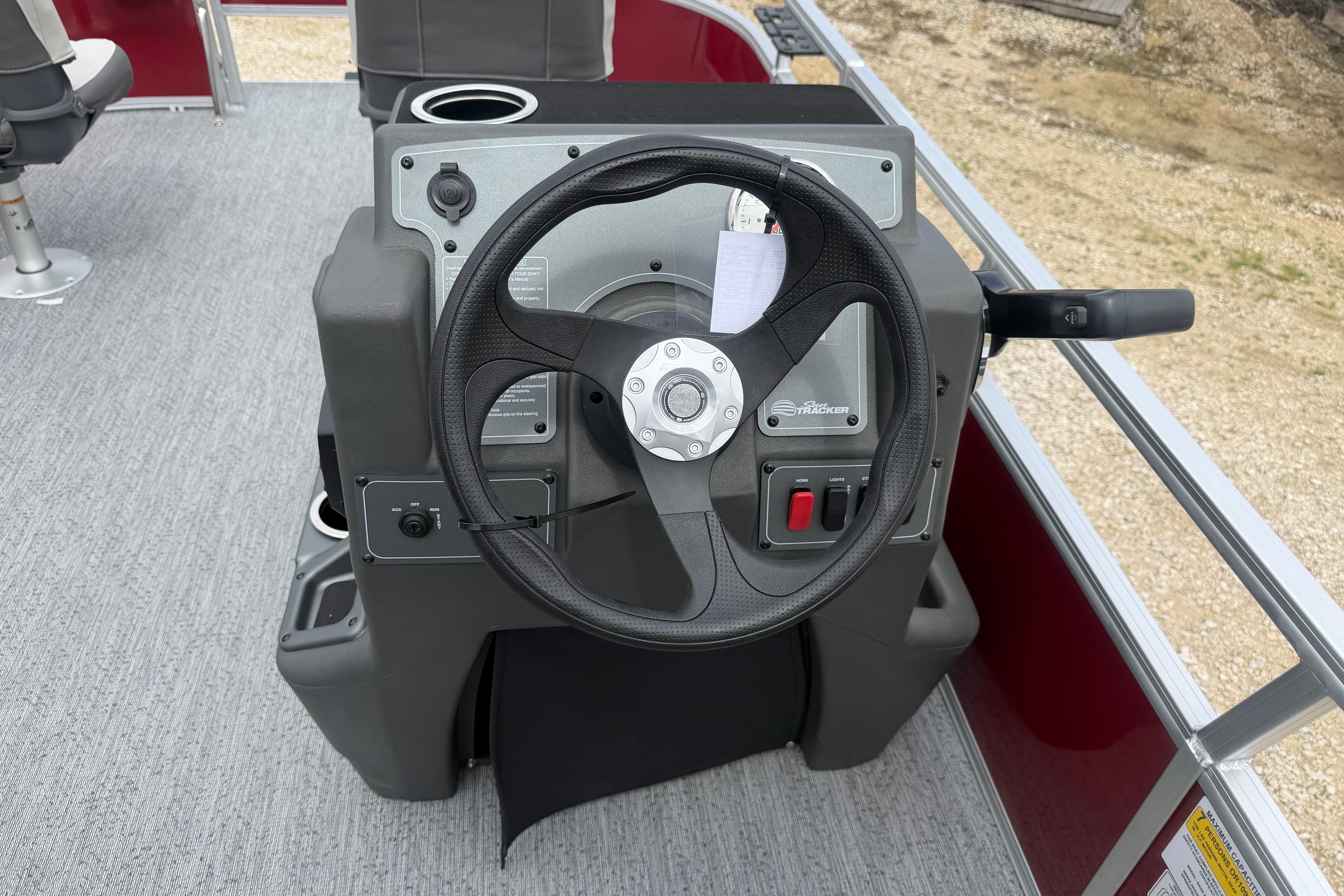 Steering console of 2026 Sun Tracker Bass Buggy 16 XL Select pontoon boat.