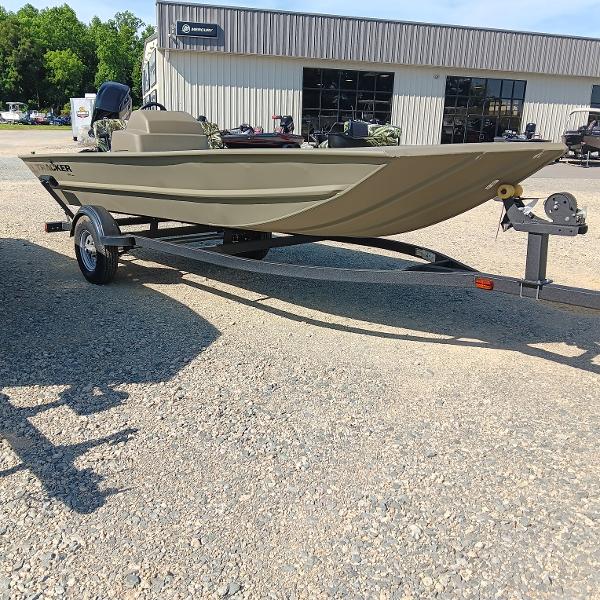 2025 Tracker Grizzly 1754 SC boat on trailer, parked outside dealership.