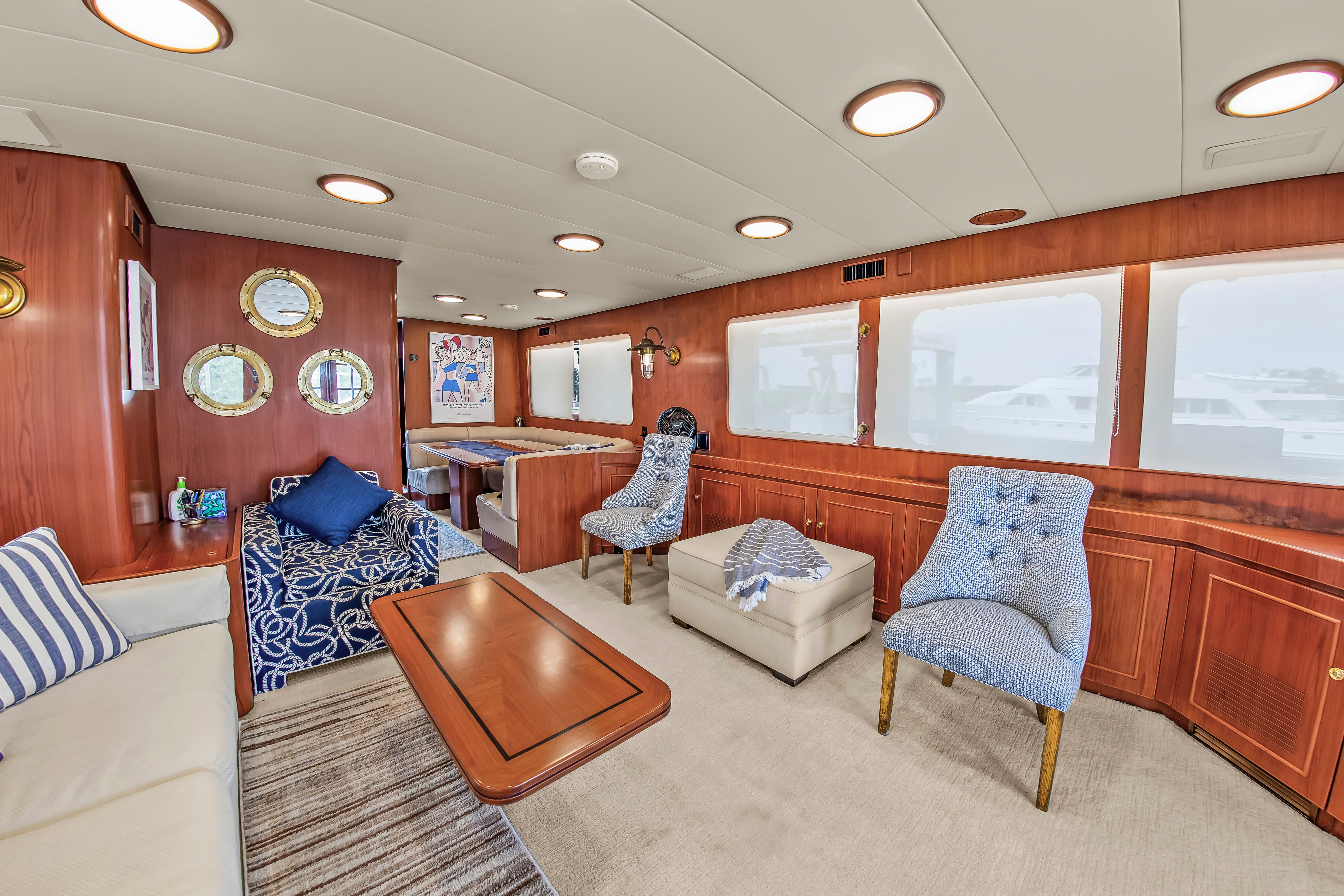 Interior of a 1987 Jongert 78 Motor Yacht with elegant wood paneling and comfortable seating.
