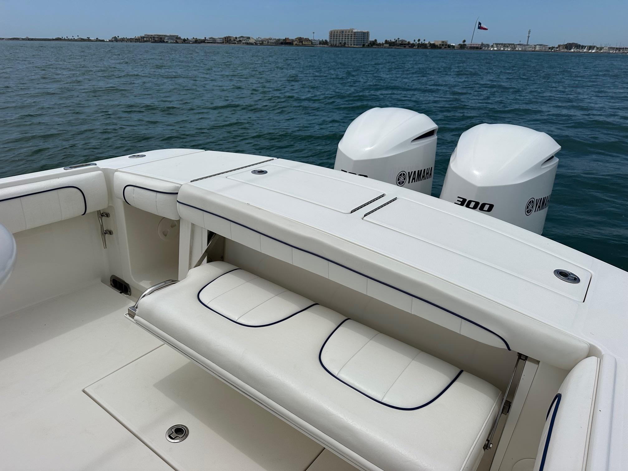 2016 Regulator center console boat with Yamaha 300 engines on open water.