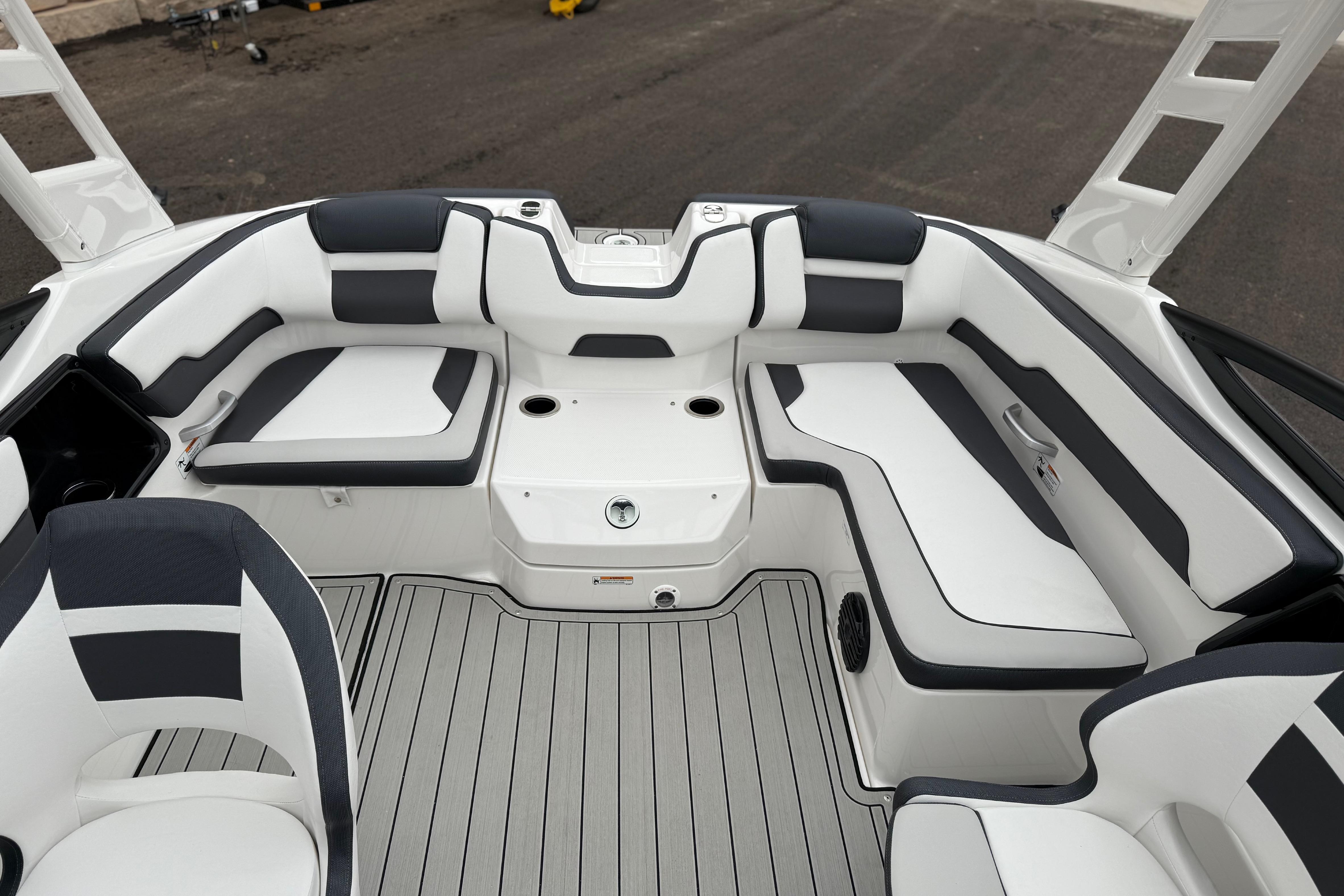 2025 Yamaha Boats 195S interior with sleek white and black seating, modern design.