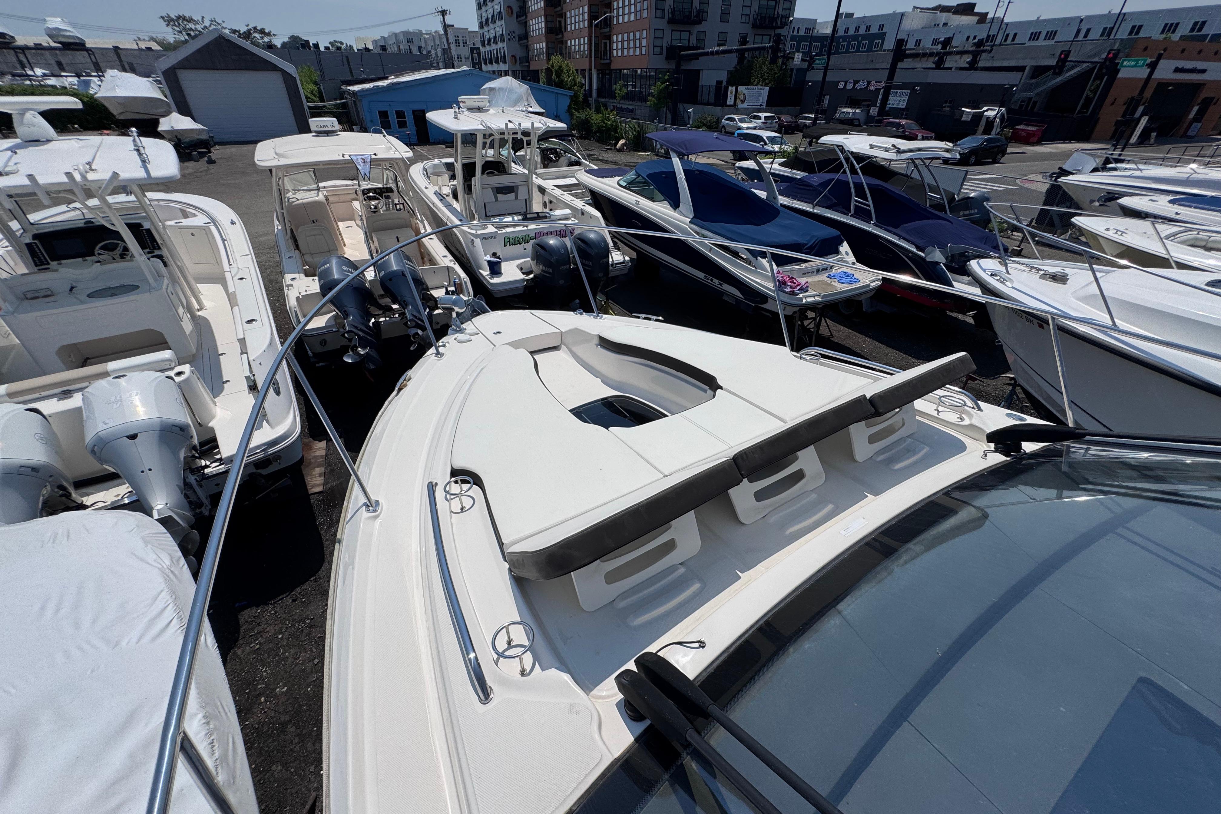 2019 Sea Ray Sundancer 350 yacht docked among other boats in a marina.