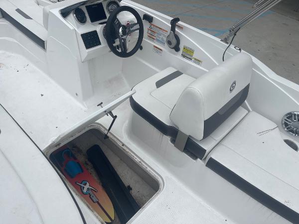 2022 Hurricane SS185 OB boat interior with storage compartment and steering console.