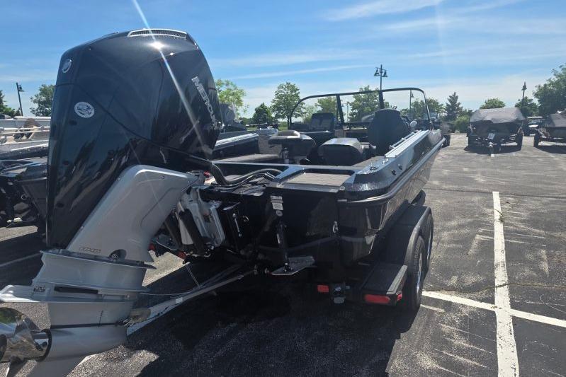 2026 Nitro ZV20 Pro boat with powerful outboard motor in a sunny parking lot.