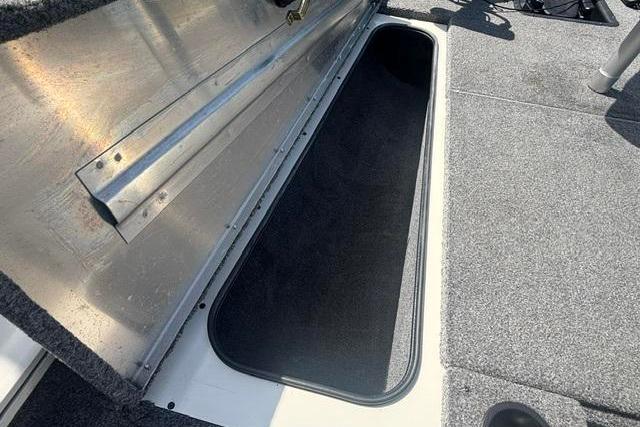 2021 Tracker Pro Team 175 TXW Tournament Edition boat storage compartment open.