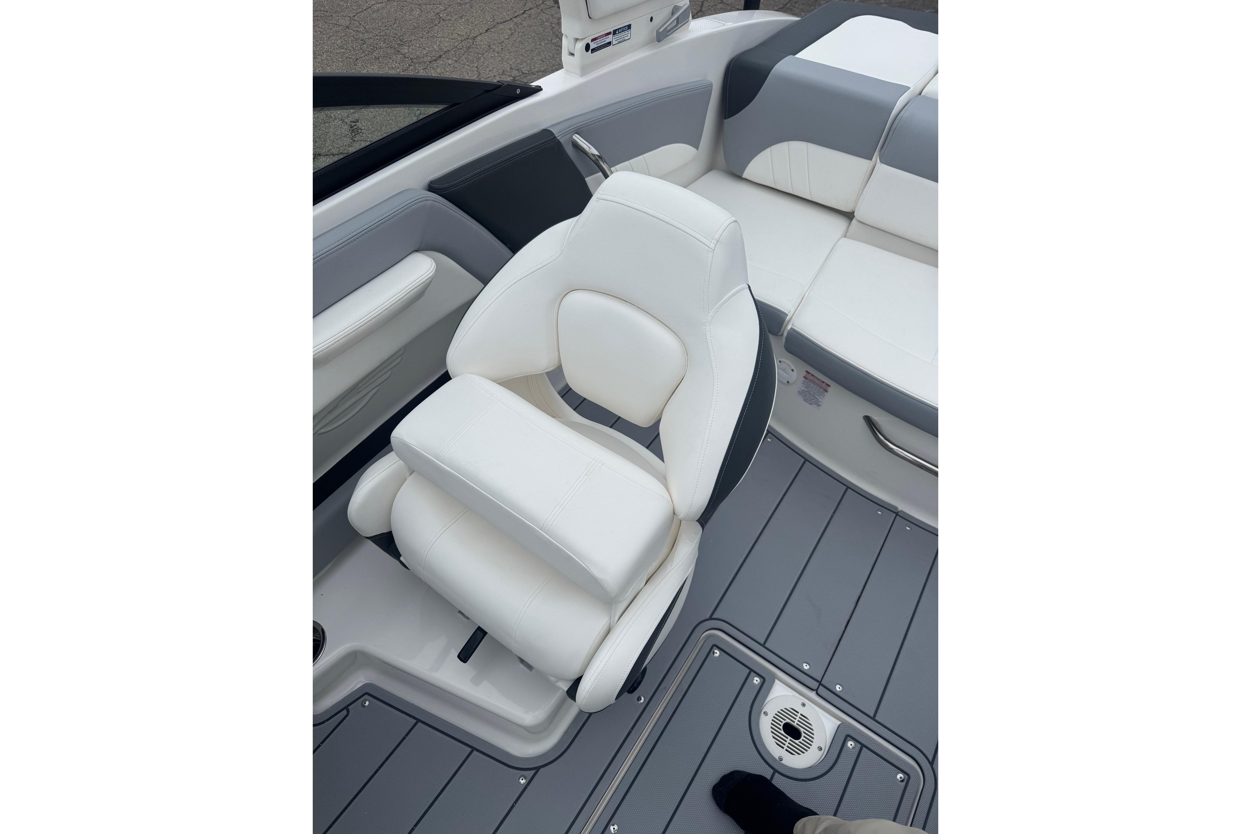 2026 Chaparral 21 SSi boat interior with white seating and gray flooring.