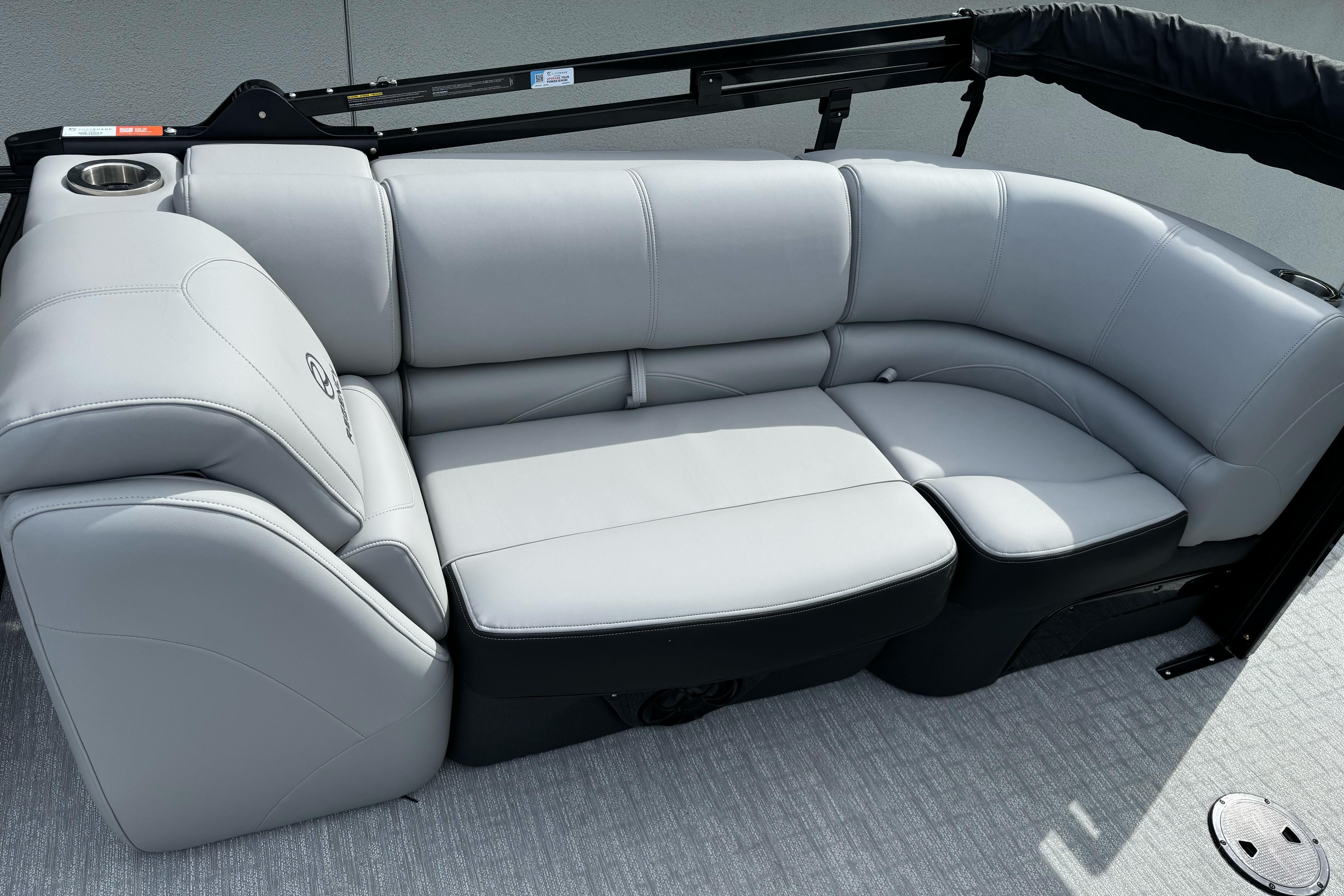 Luxurious seating on 2026 Regency 250 DL boat, featuring sleek gray upholstery.