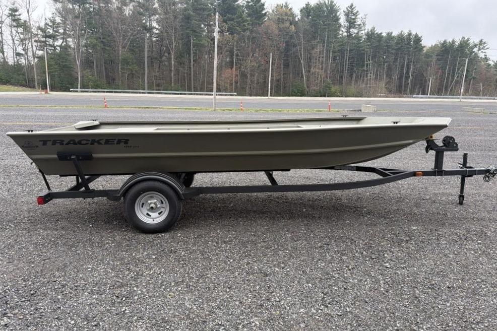 2026 Tracker Grizzly 1754 Utility boat on trailer in outdoor setting.