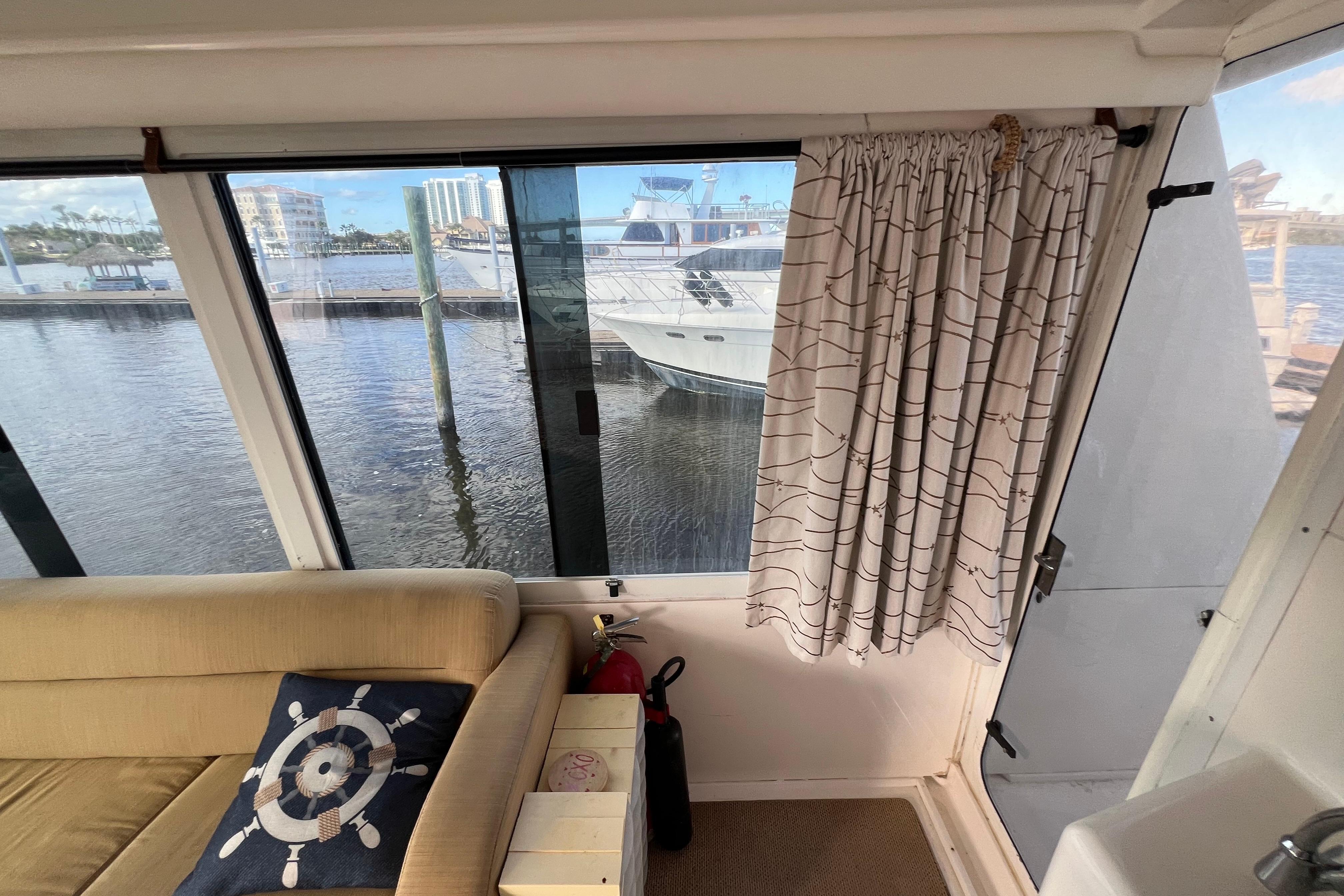 Interior view of 1999 Viking 60 CPMY yacht with waterfront scenery.