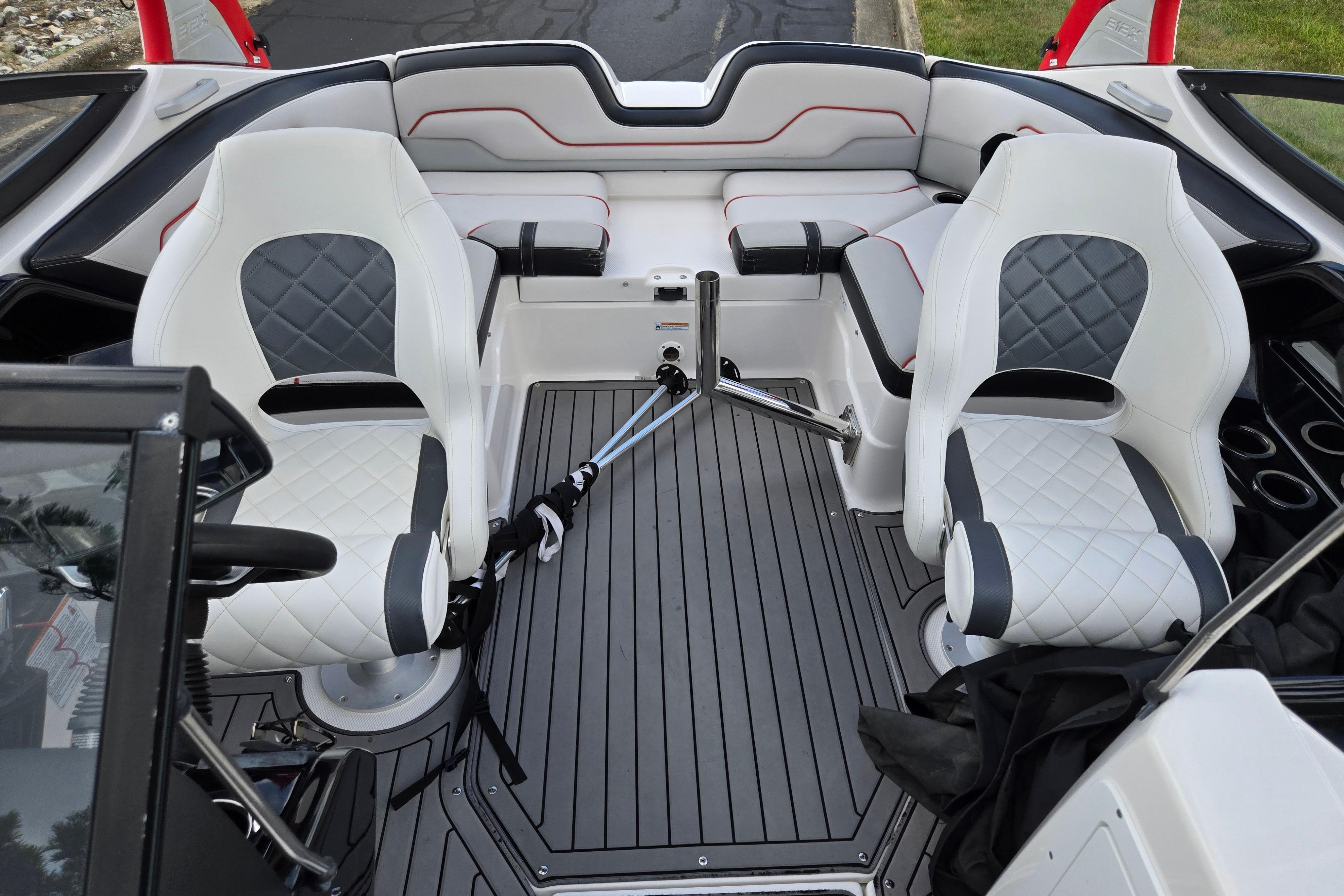 2018 Yamaha Boats 212X interior with white and gray seating, sleek design, and modern features.