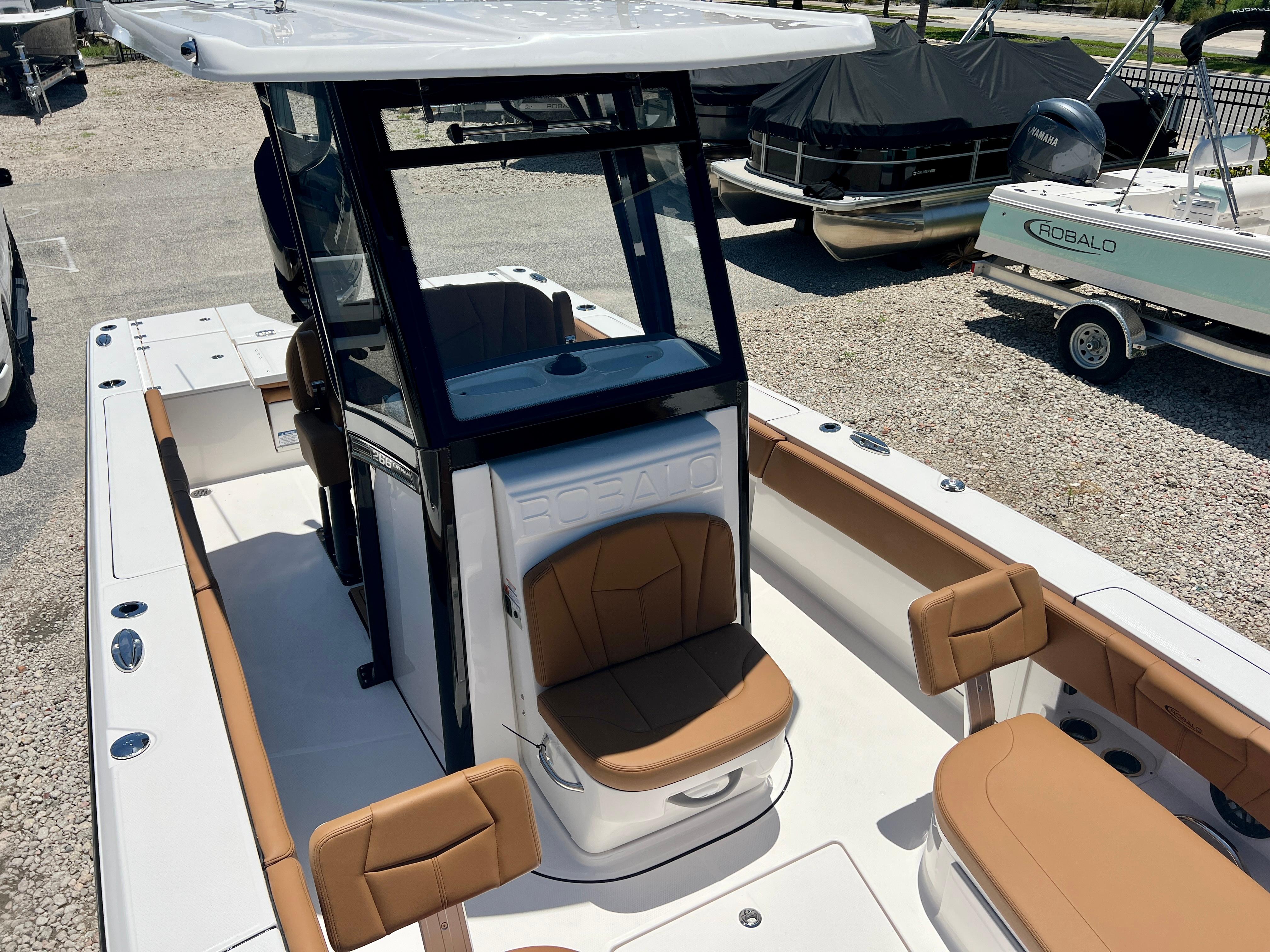 2025 Robalo 266 Cayman boat with brown seats and white deck.