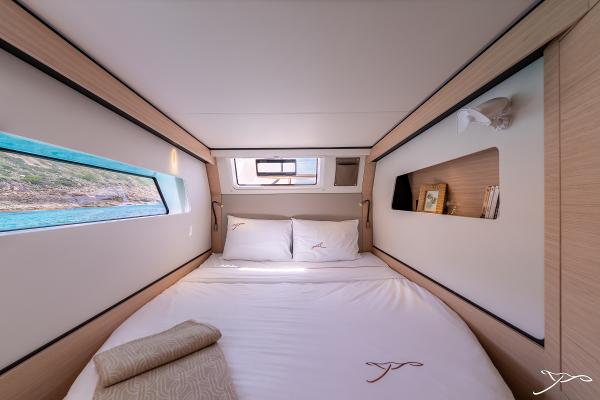 Luxurious cabin interior of 2025 Nautitech 44 Open yacht with scenic window view.