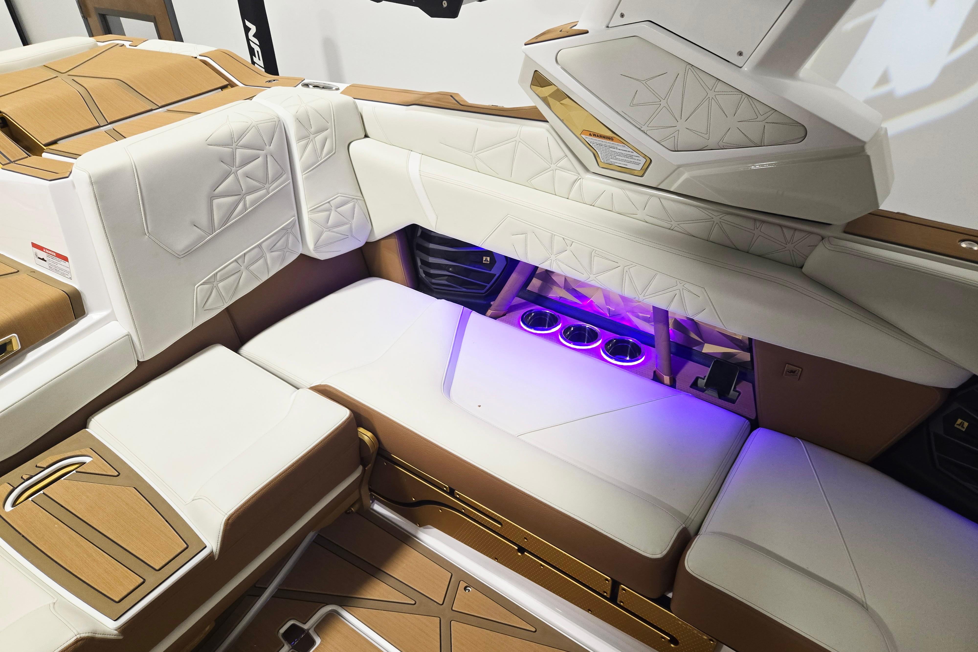 Luxurious interior of 2026 Nautique Super Air Nautique G23 Paragon with ambient lighting.