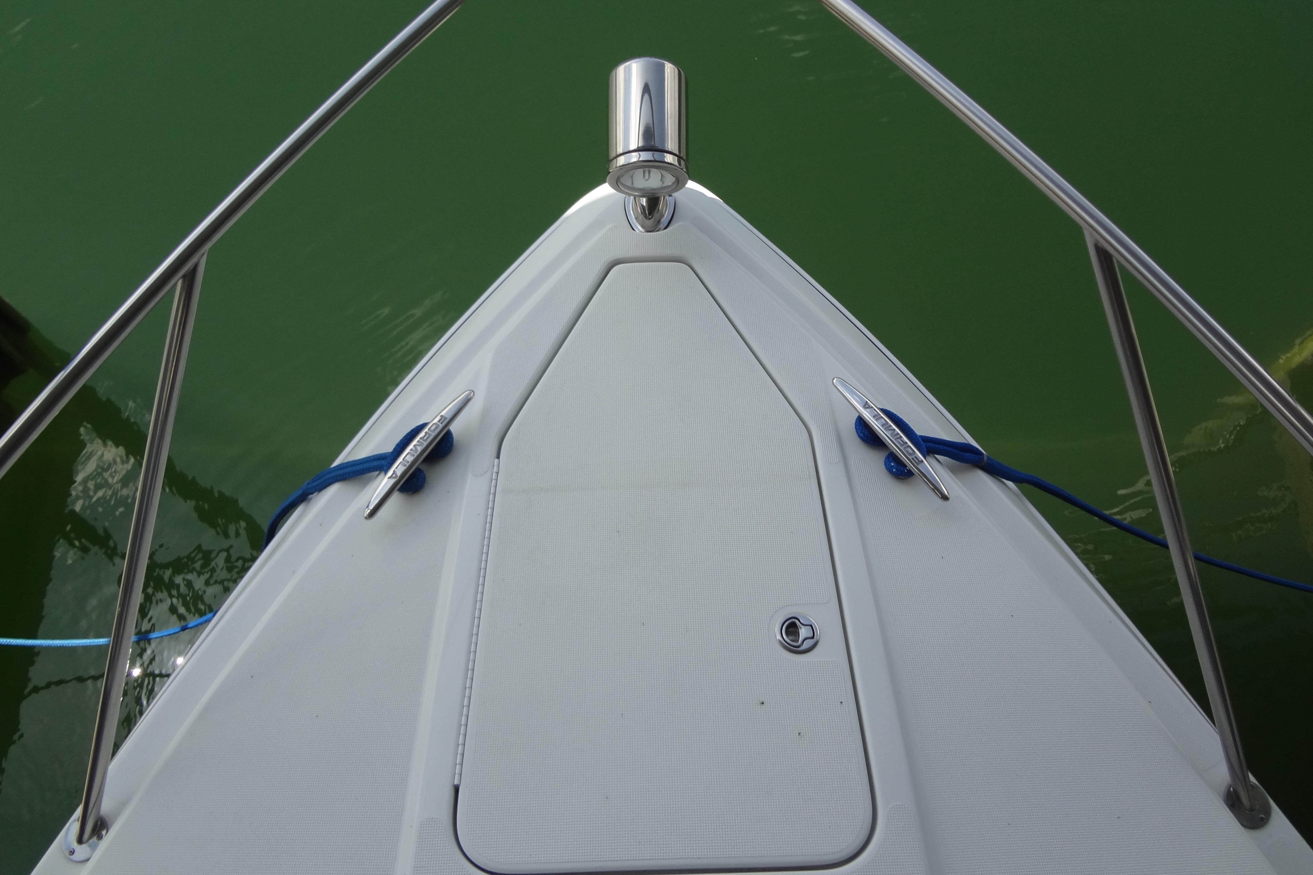 Bow of a 2007 Formula 34 Performance Cruiser with stainless steel railings.