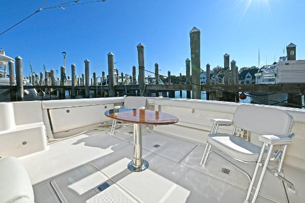 2008 Tiara Yachts 4200 Open deck with seating and table, docked at marina.