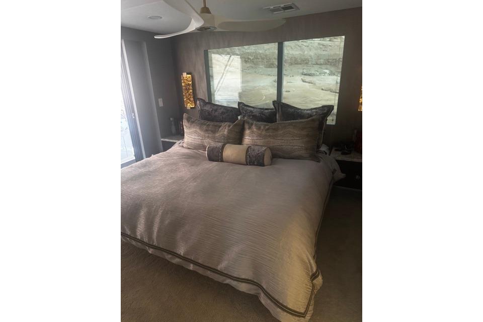Luxurious bedroom interior in Adonia's 2021 "The Queen Elizabeth" model, featuring elegant bedding.