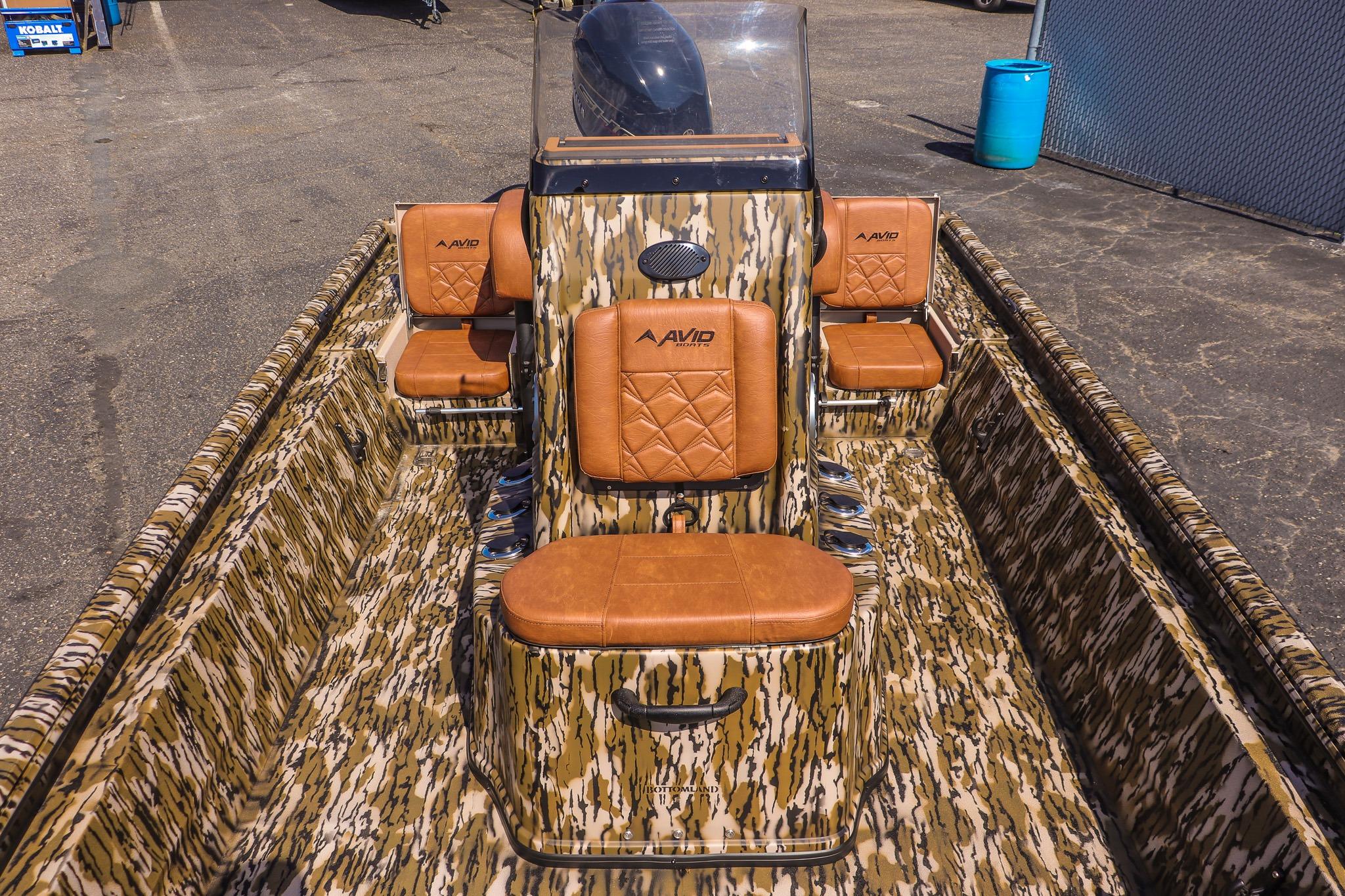 Avid 20 Rogue CC from 2027 with camouflage pattern and brown leather seats.