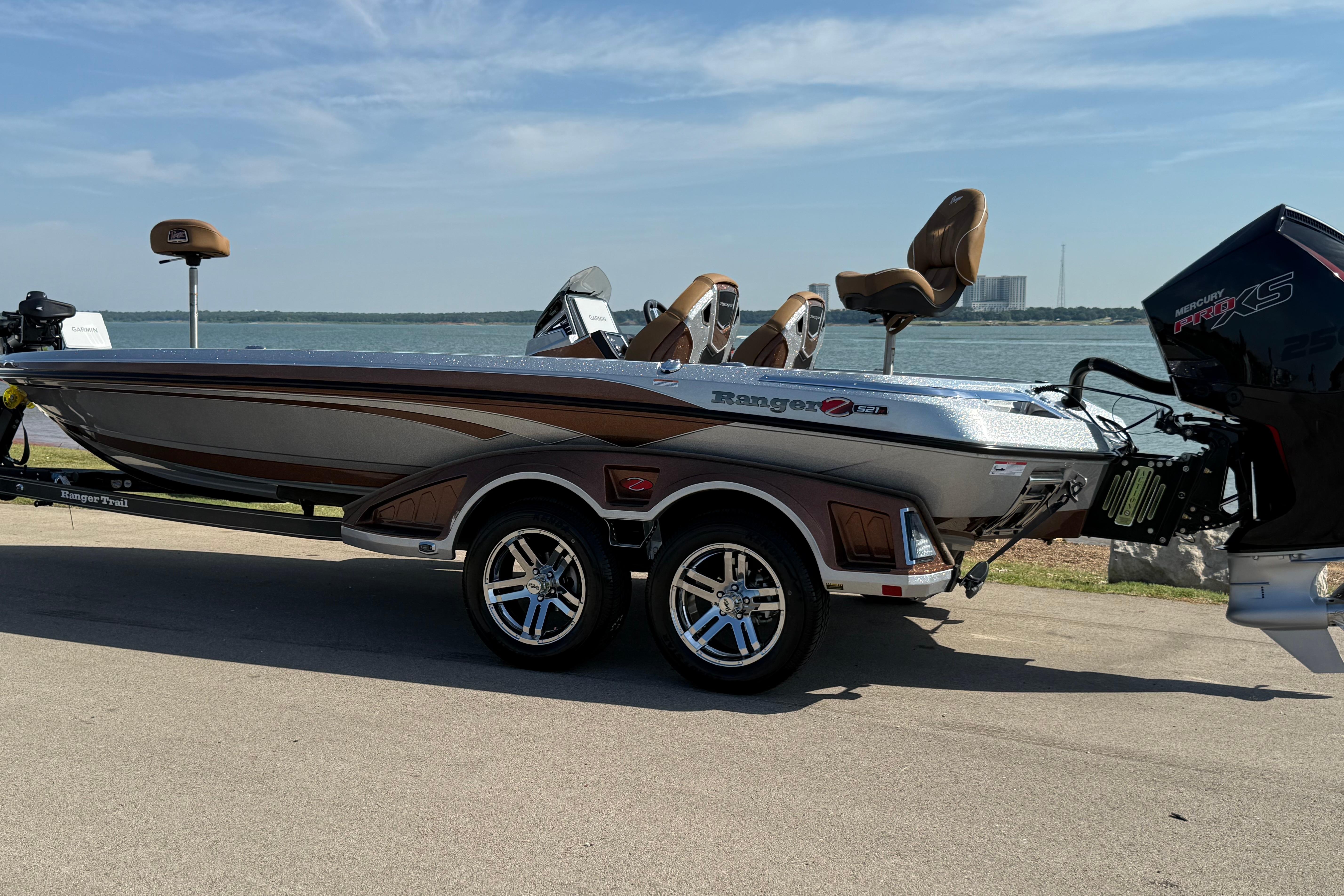 2026 Ranger Z521R boat with Mercury Pro XS engine, parked by a scenic lake.