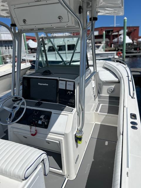 2003 Regulator 26 Forward Seating boat with modern helm and spacious deck.