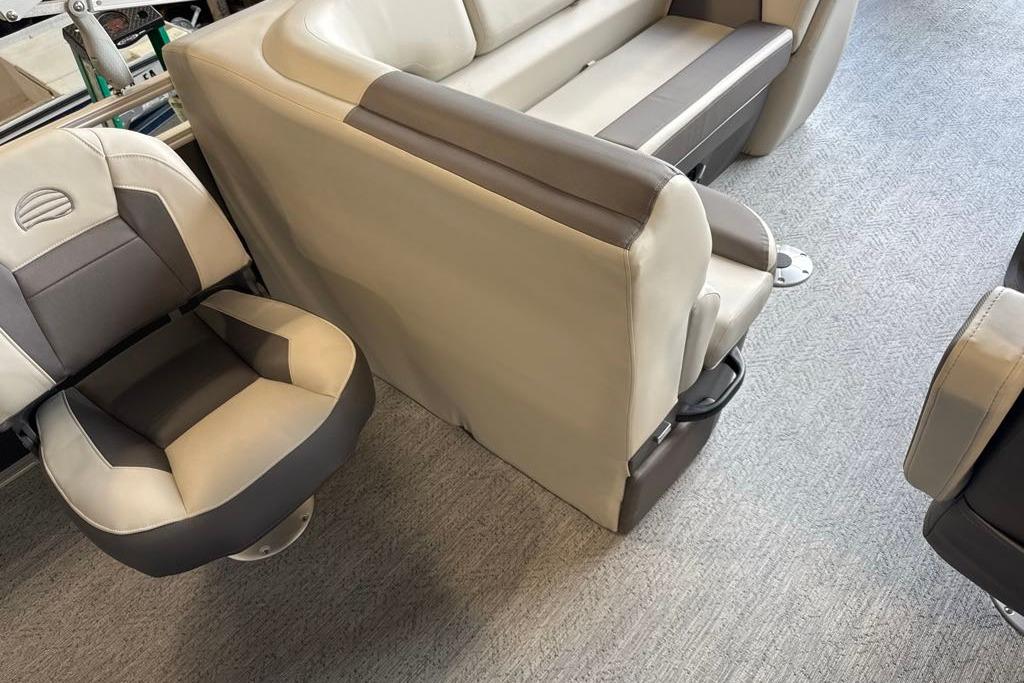2026 Sun Tracker Fishin' Barge 20 DLX interior seating, featuring plush, two-tone upholstery.