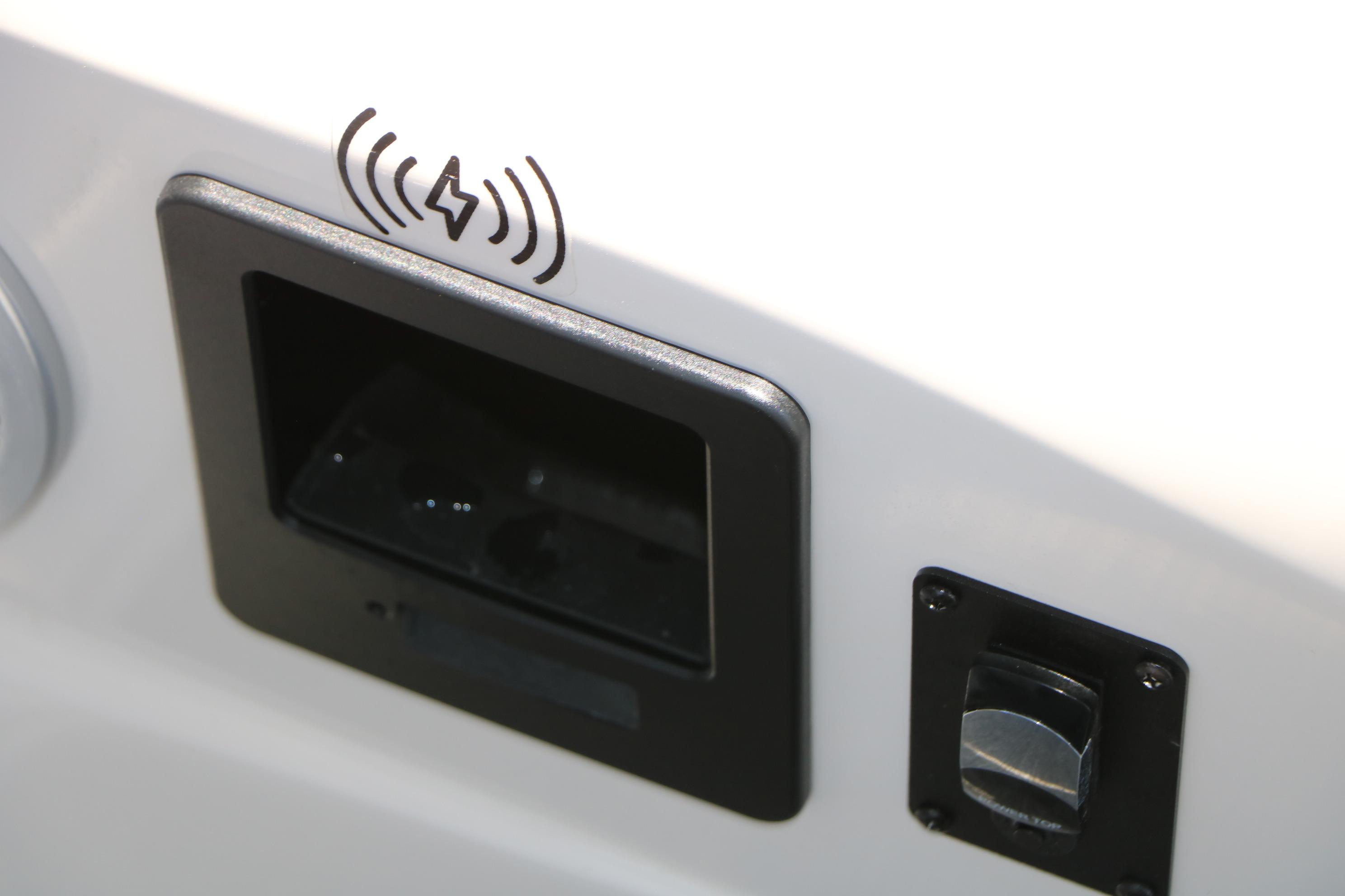 2024 Bennington 23 RX SWINGBACK wireless charging pad and control switch detail.
