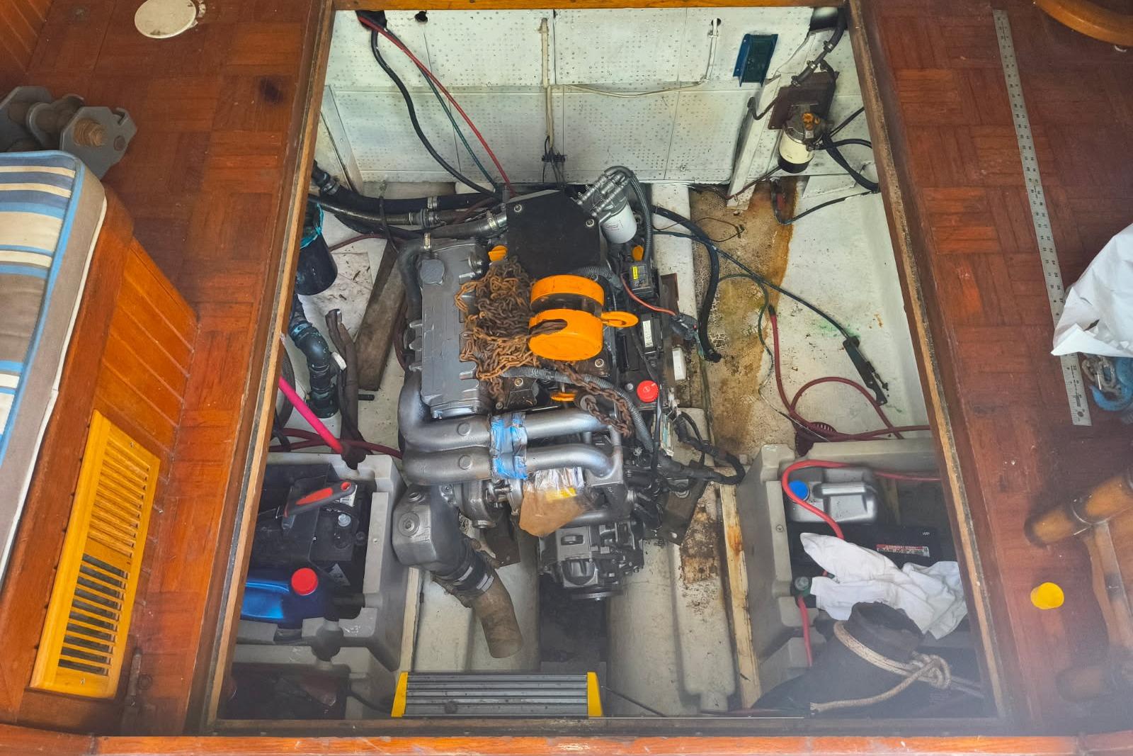 Engine room of a 1984 Kadey-Krogen Manatee boat, showcasing mechanical components.