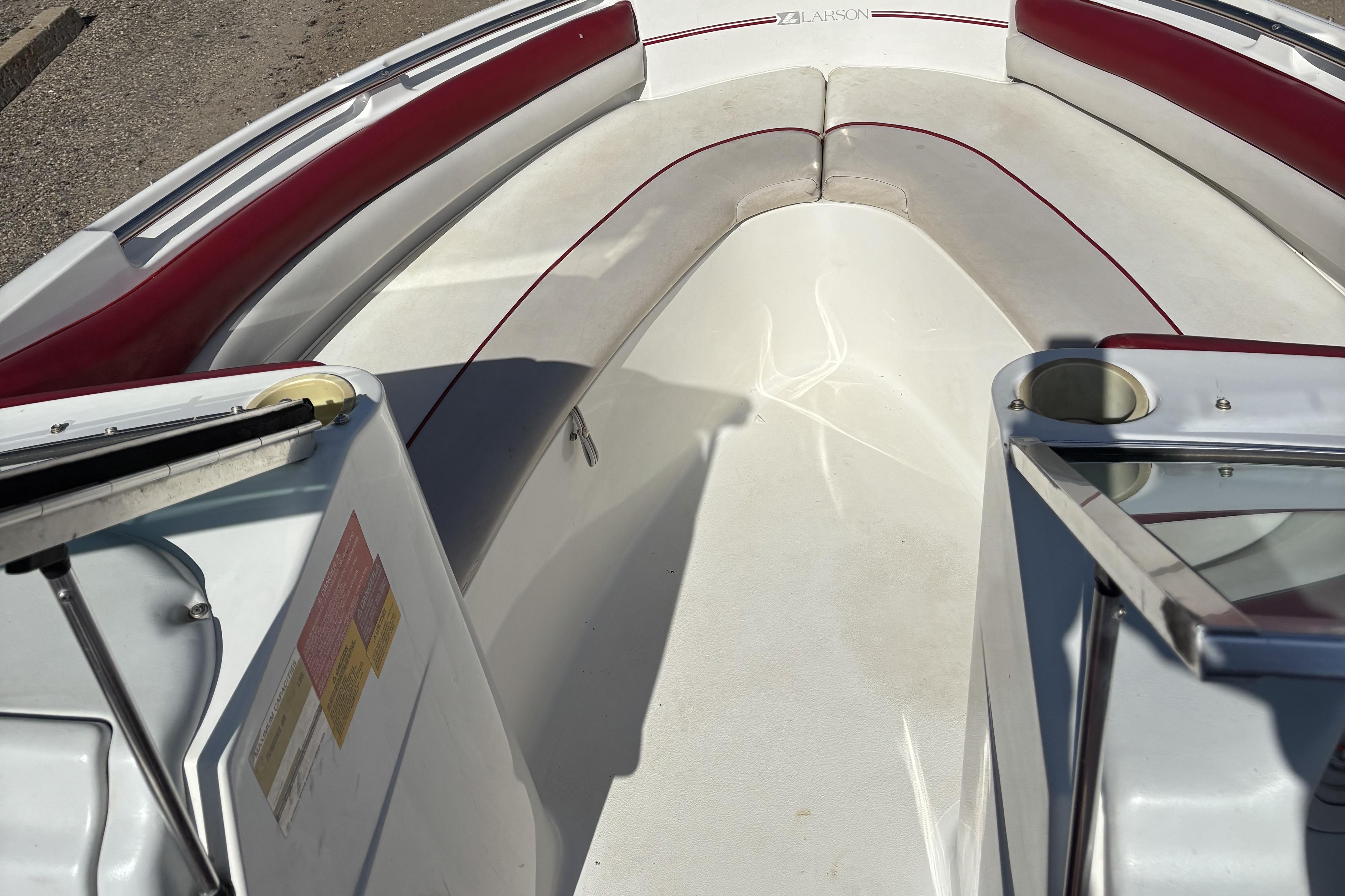 1993 Larson SEi 200 Cuddy I/O boat interior with red and white seating.