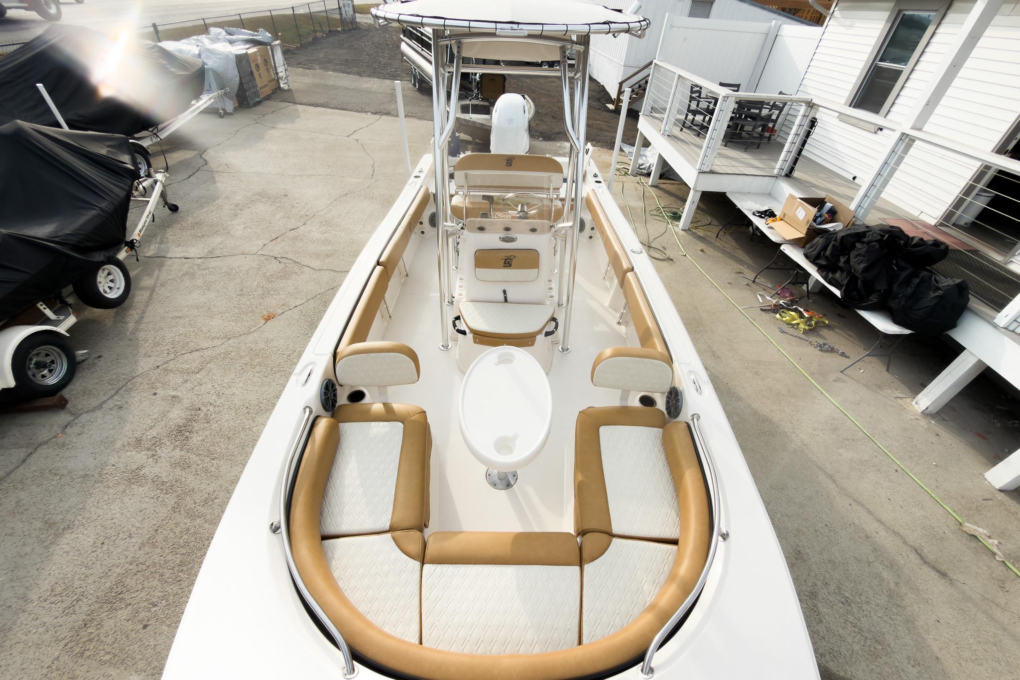 2025 Carolina Skiff 21 Ultra Elite boat, top view, docked, showcasing seating and console.