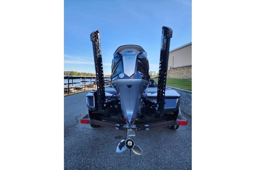 2026 Skeeter FXR21 Limited boat, rear view with powerful outboard motor and dual power poles.