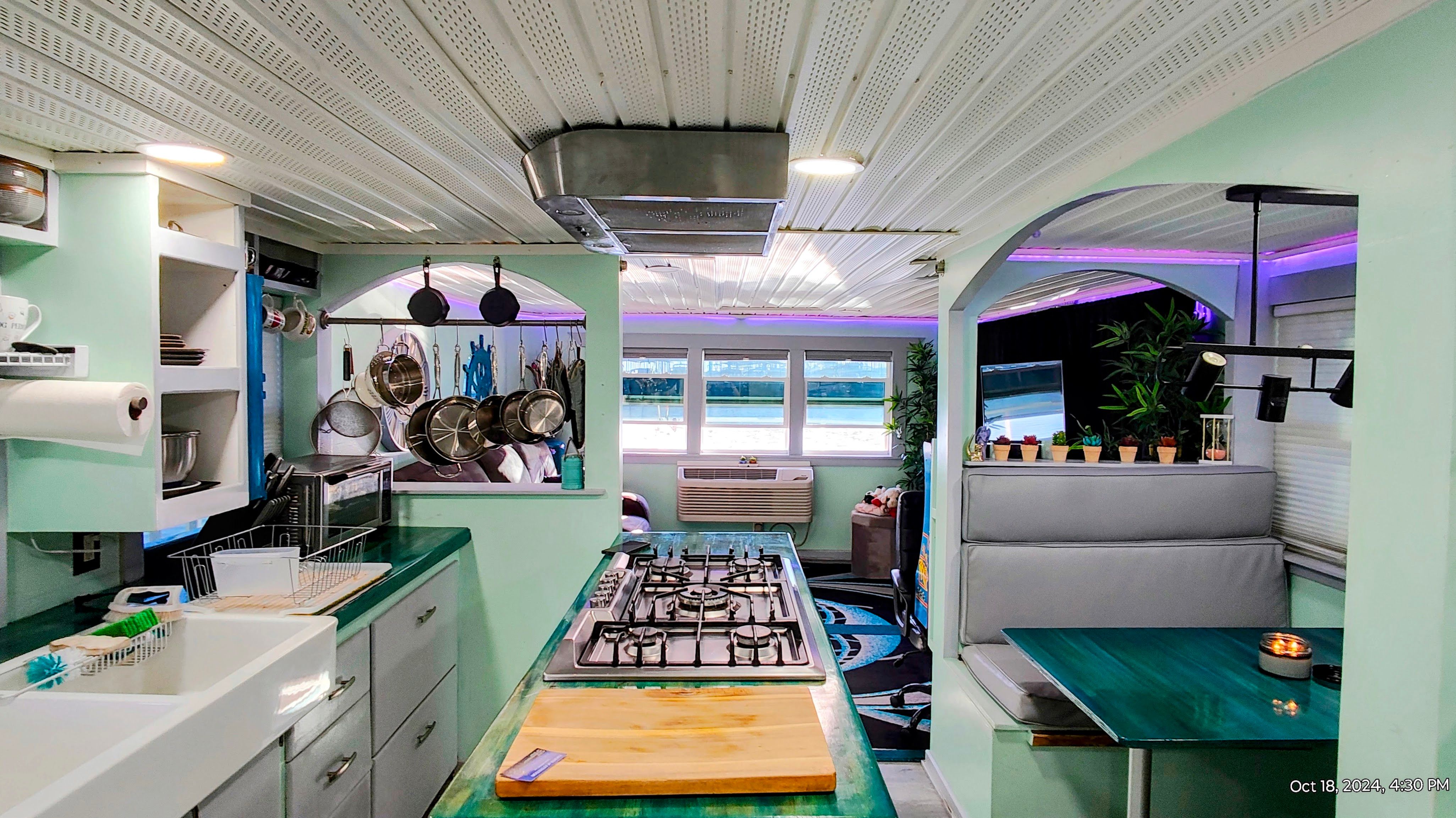 Interior of a renovated 1964 Kelly 62' with modern kitchen.