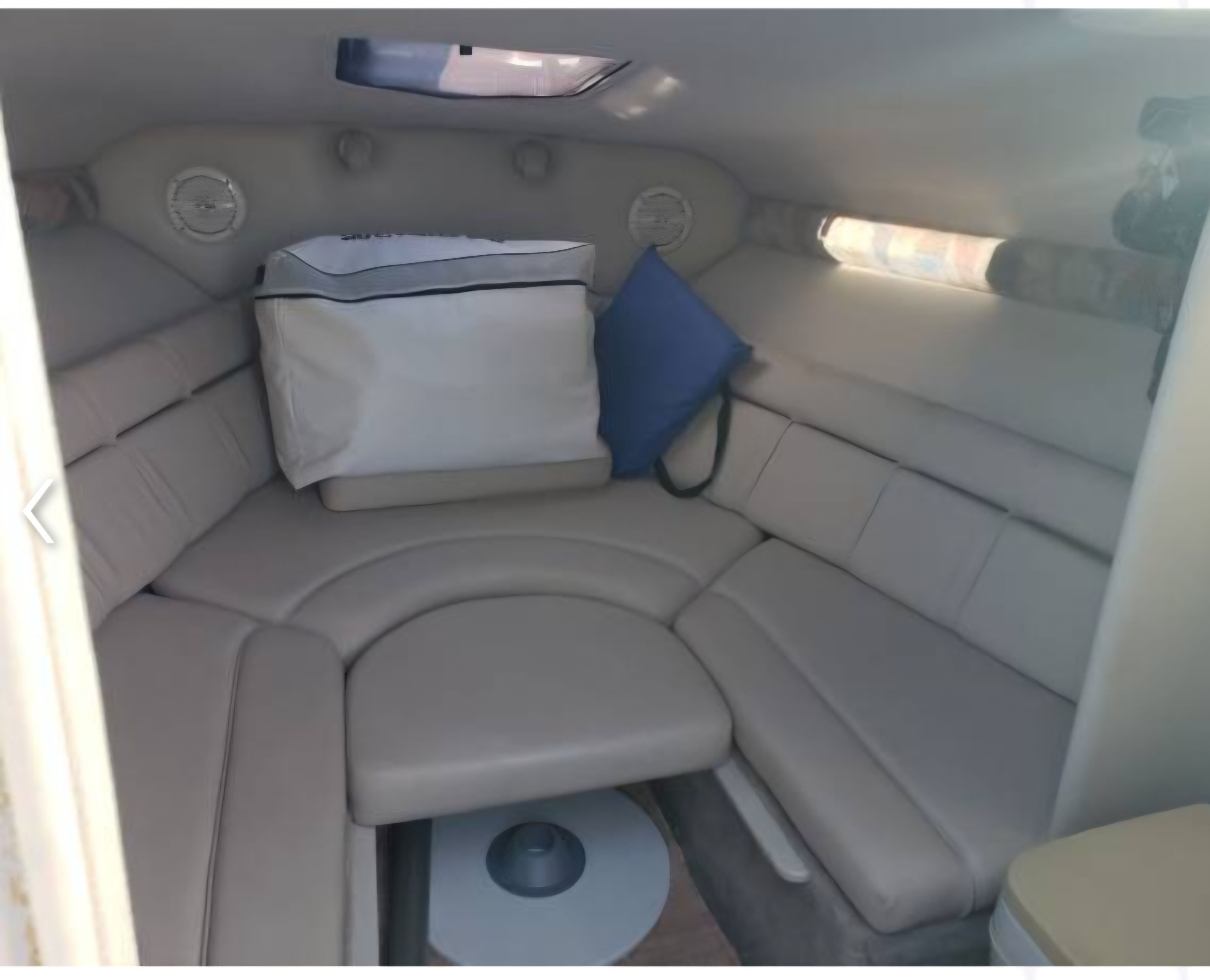 Interior of a 2003 Crownline 215CCR with cushioned seating.
